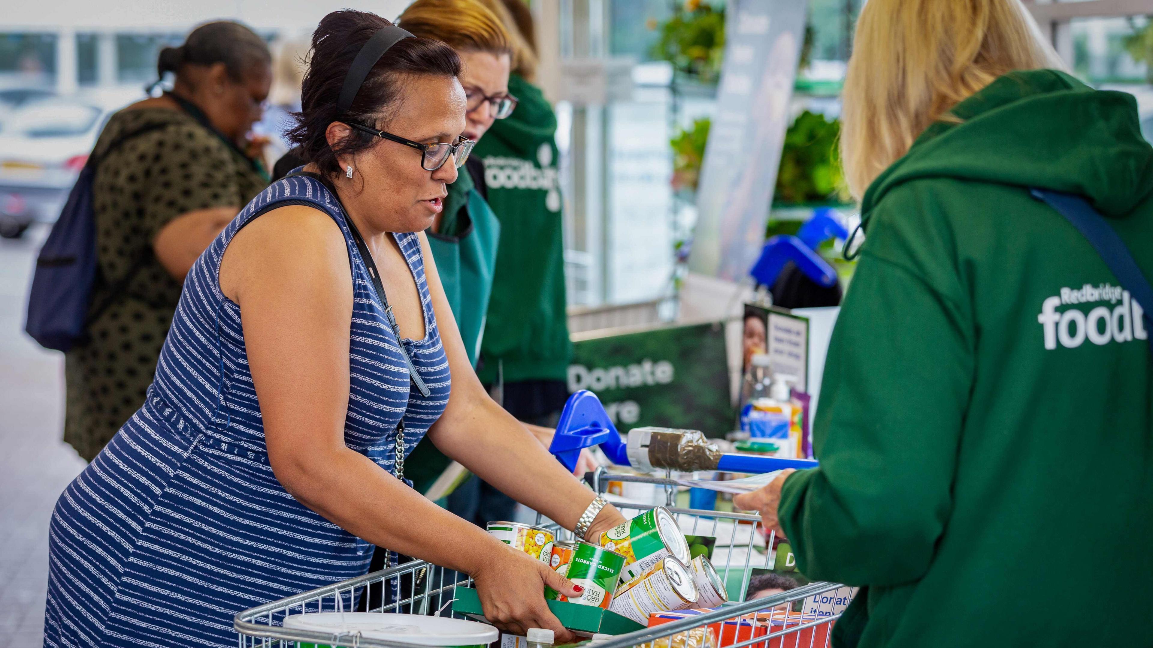 Shopper packing food in Tesco