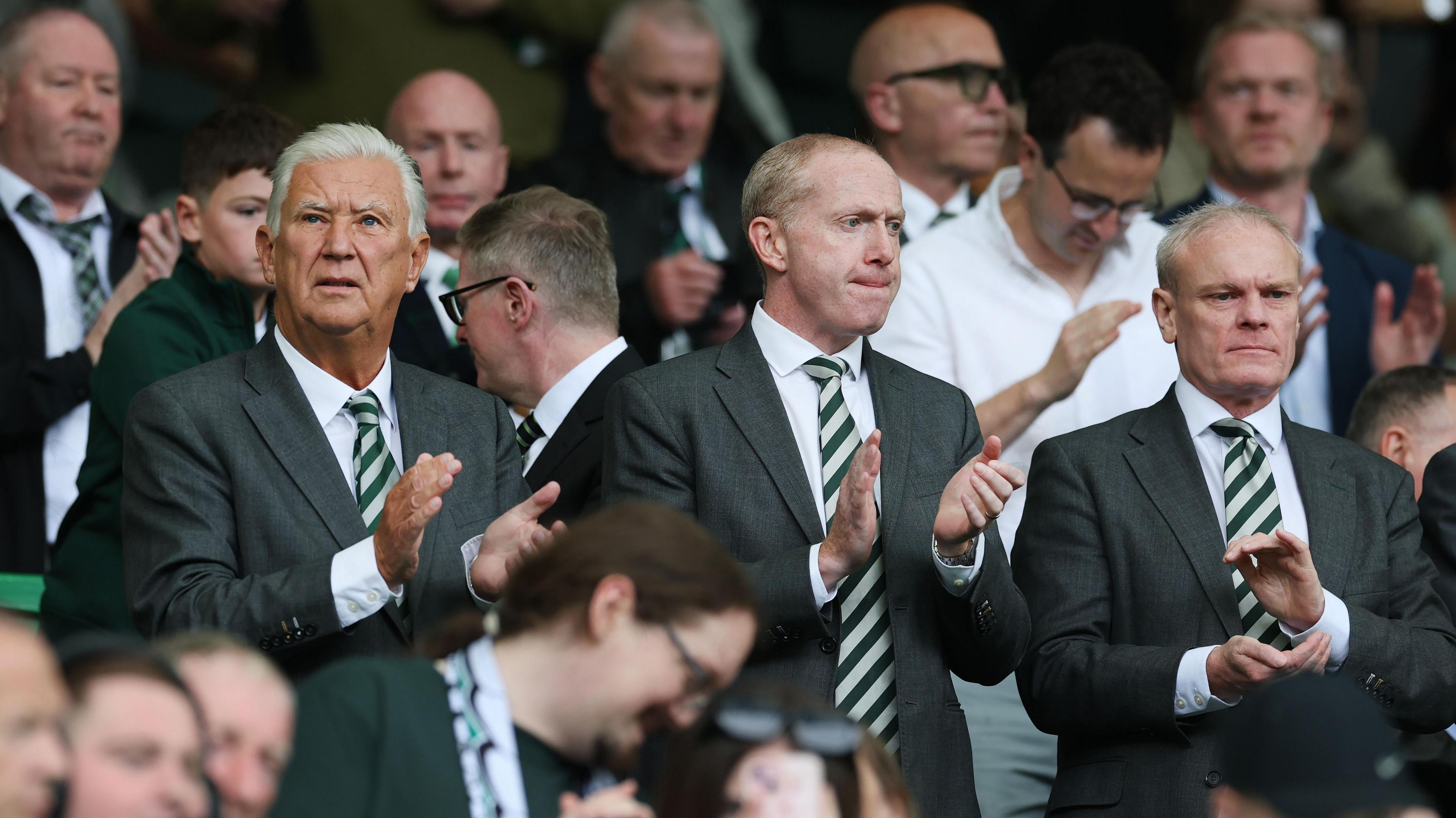 Celtic Chairman Peter Lawwell (L), Chief Executive Officer Michael Nicholson (C) and Chief Financial Officer Christophe McKay