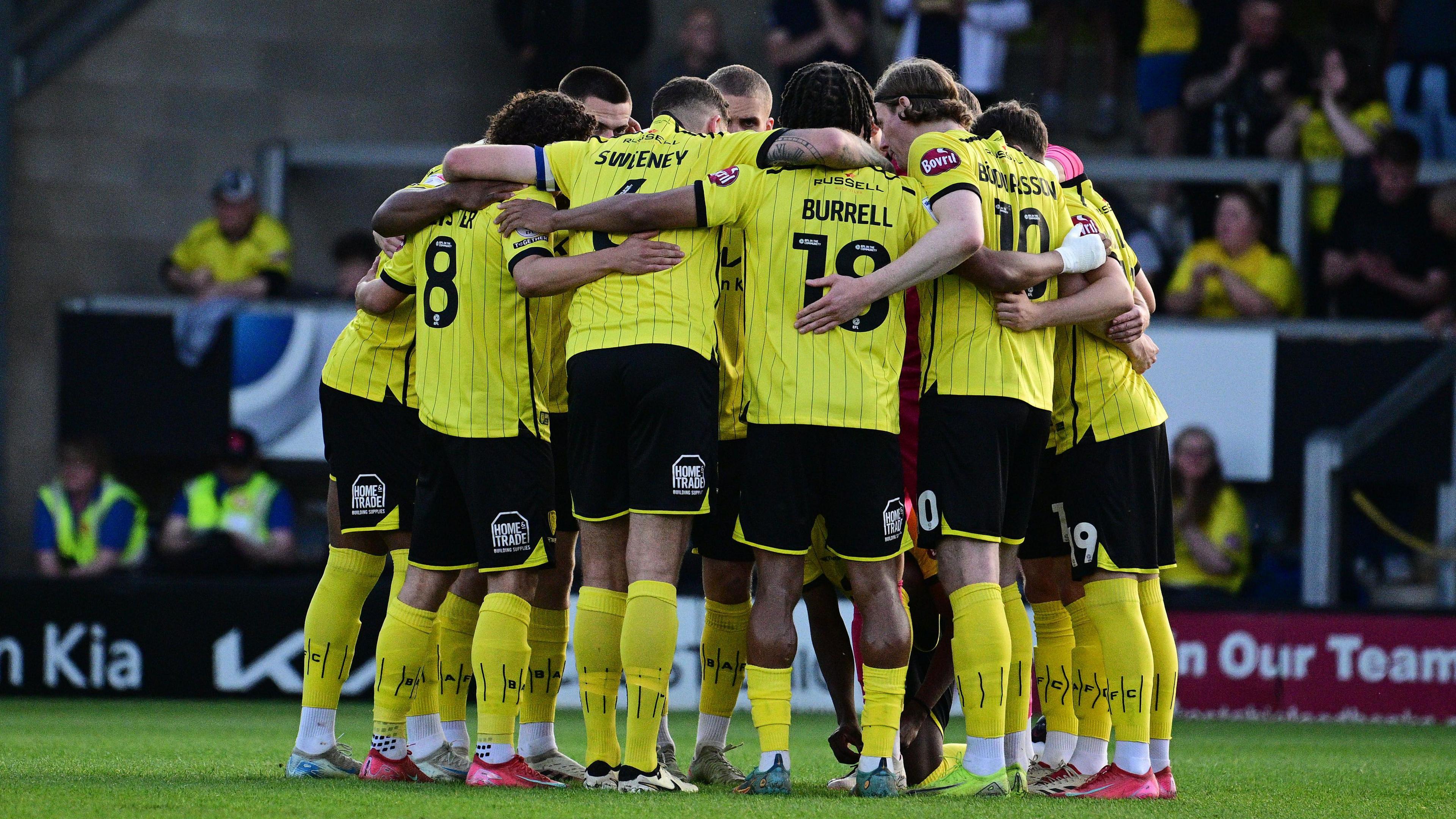 Burton Albion players in a huddle