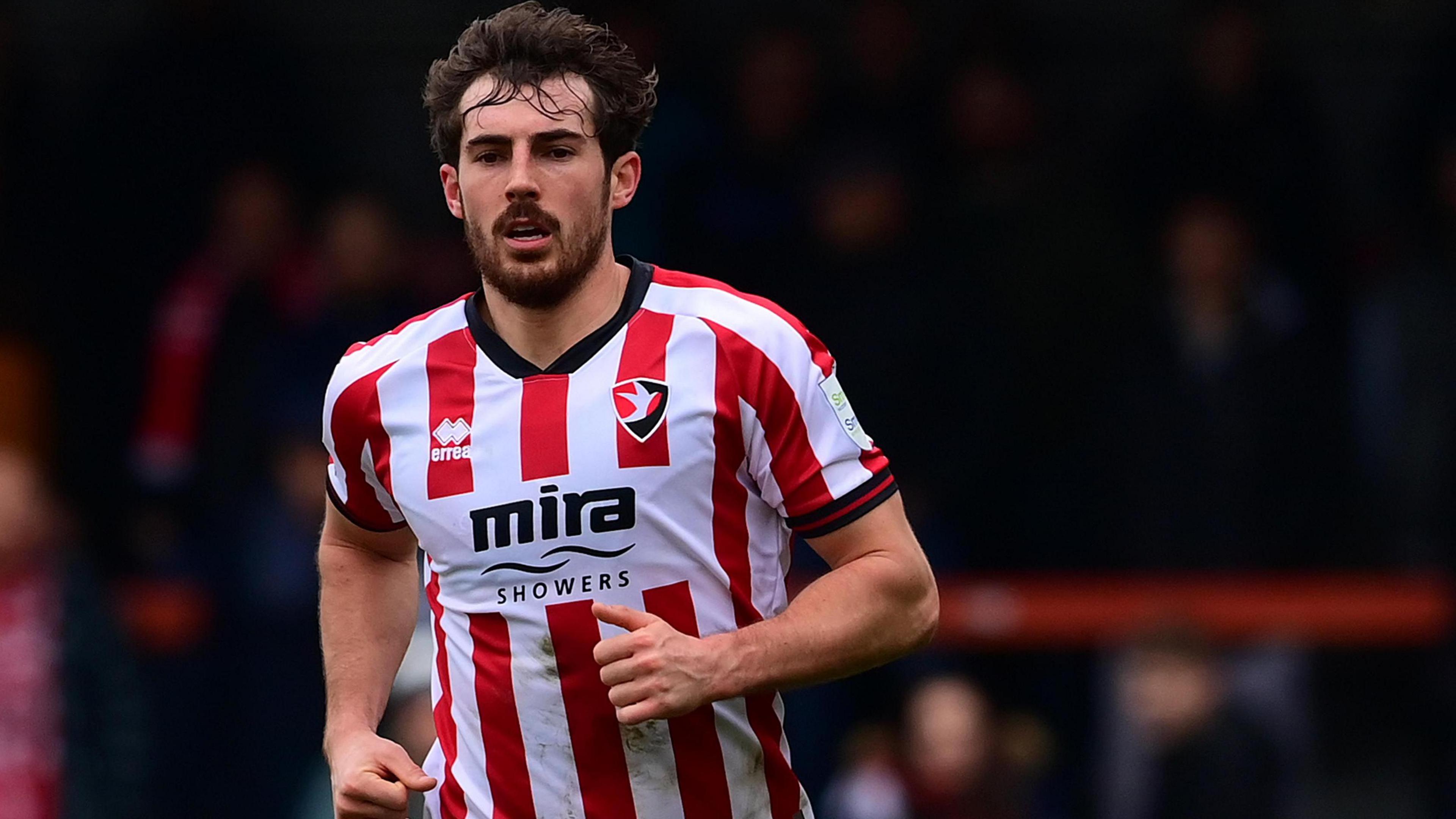 Sam Stubbs in action for Cheltenham Town