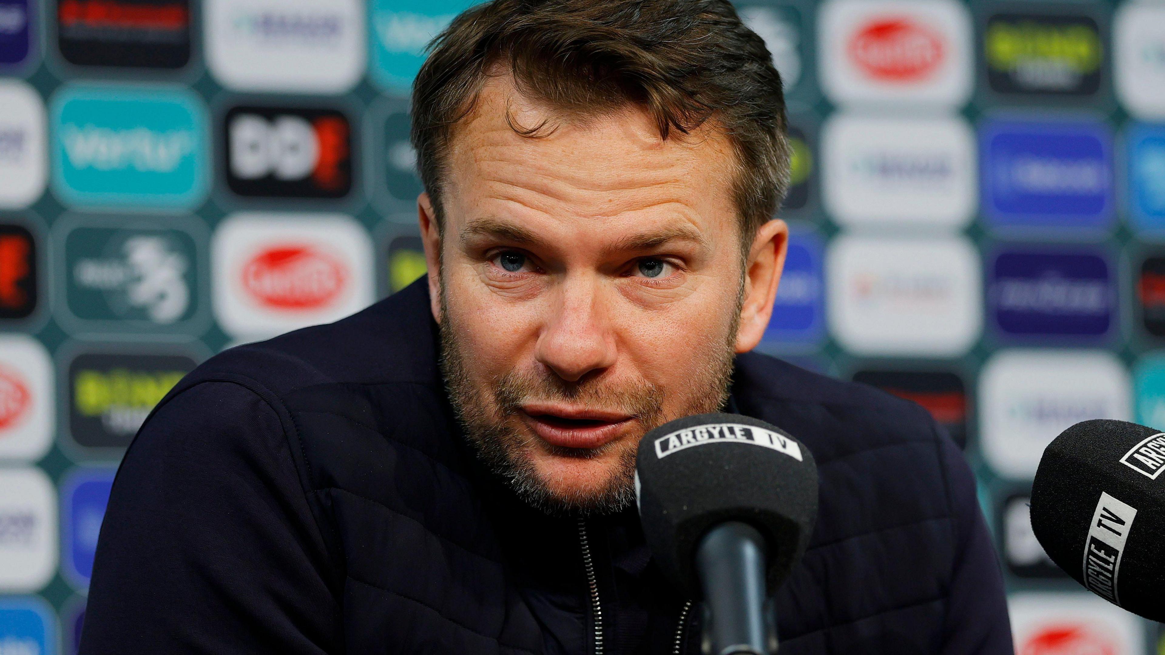 Tom Cleverley conducting a Plymouth Argyle press conference.