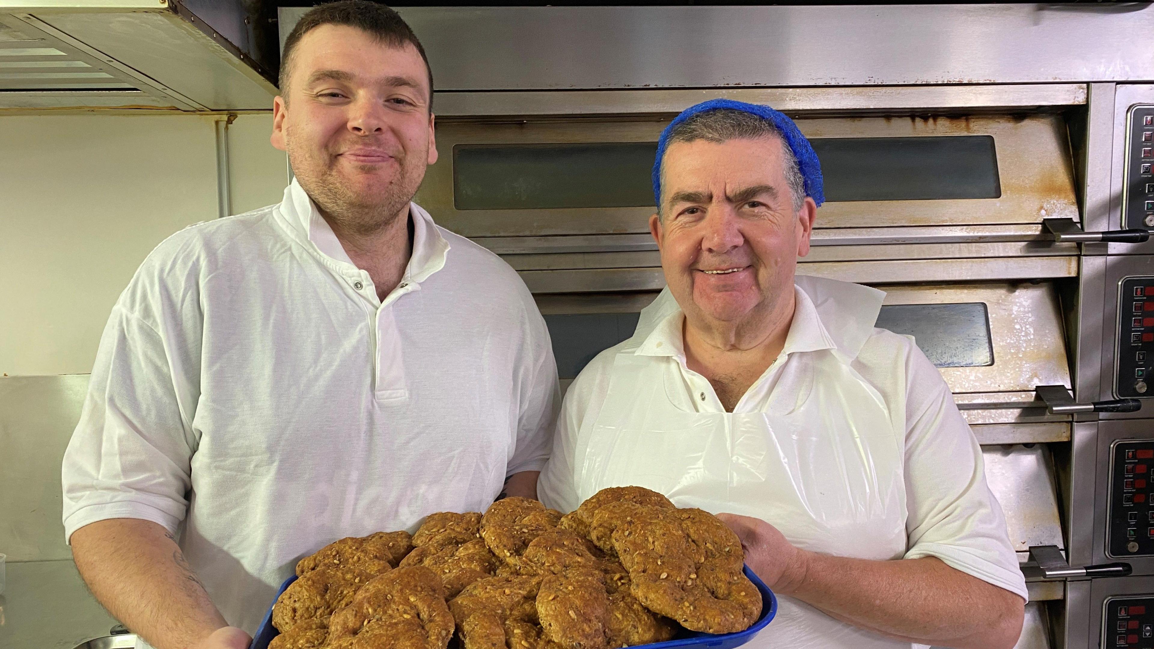 Bakers with a tray of healthier butteries 