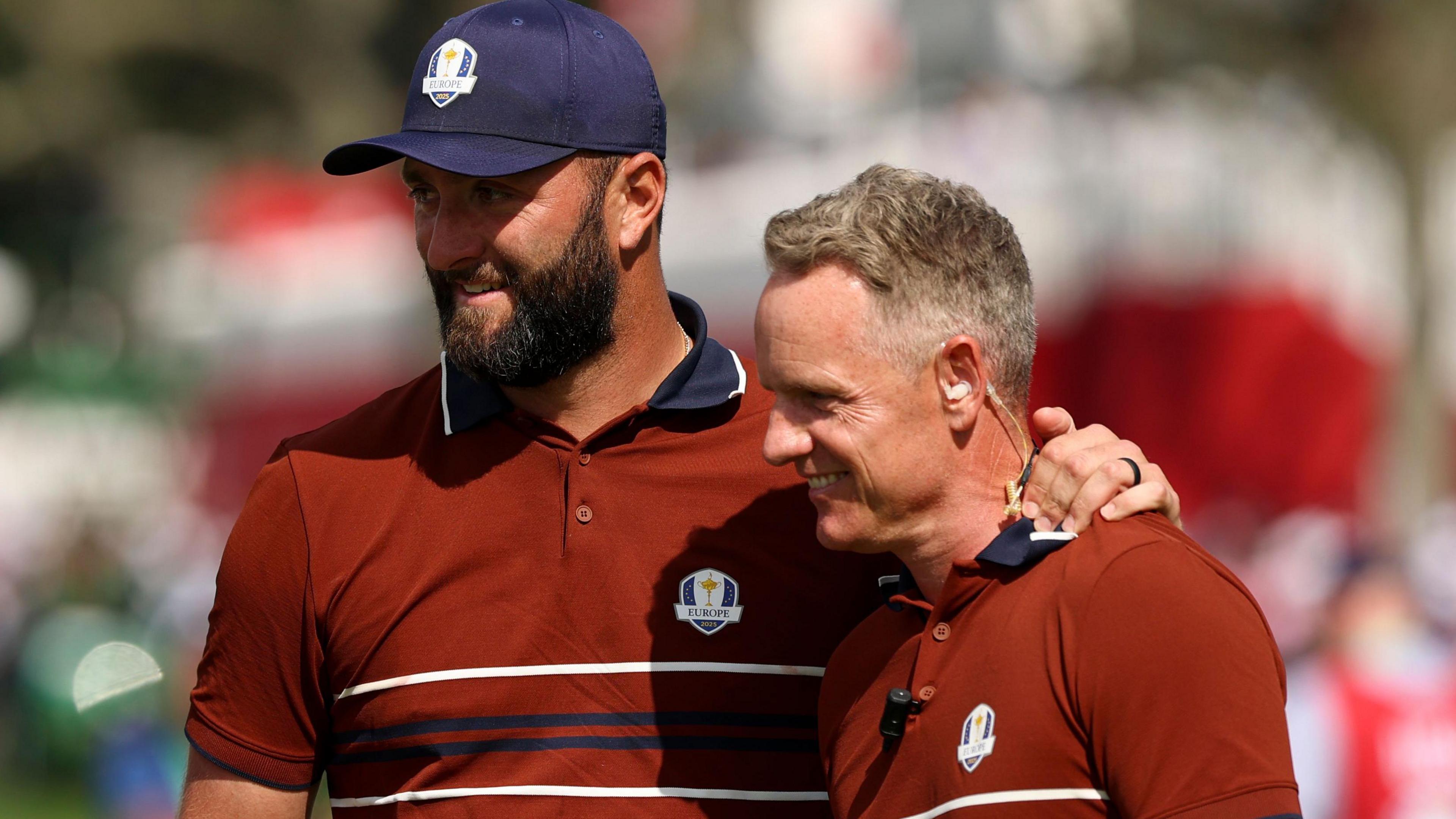 Jon Rahm with his arm round the shoulder of his Ryder Cup captain Luke Donald