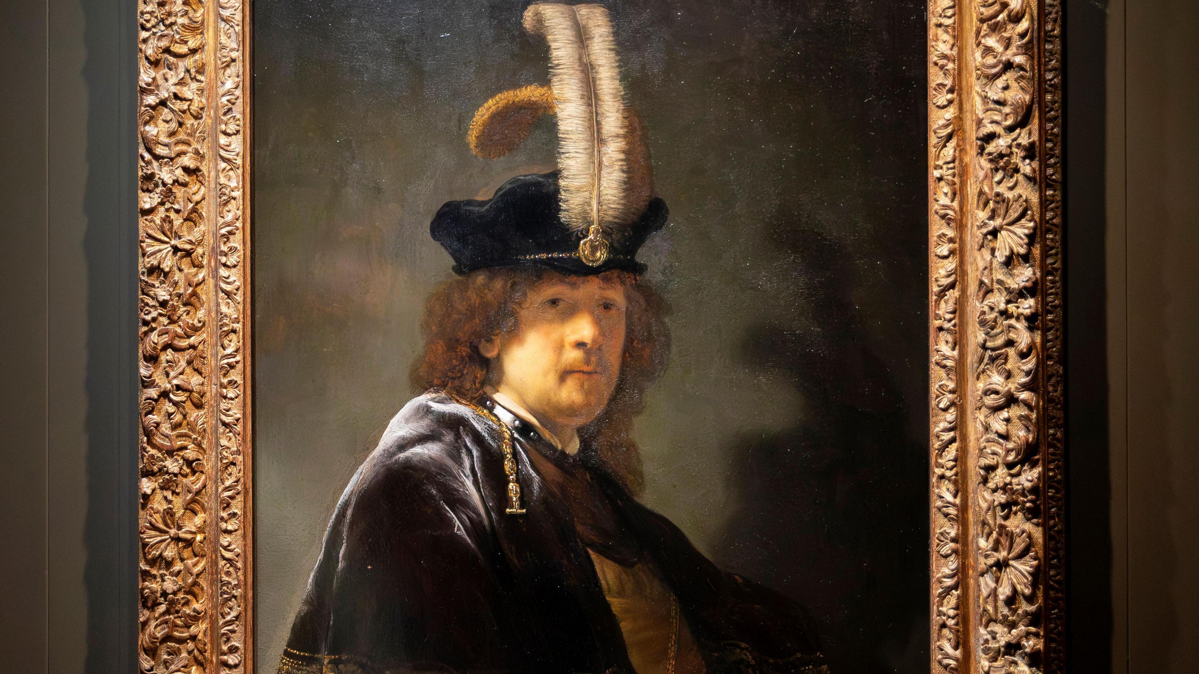A self portrait of the Artist Rembrandt gifted to the National Trust in 2010, with the artist wearing a black velvet cap with two ostrich feathers, a decorative metal band worn round the neck and a short, decorated velvet cape.  