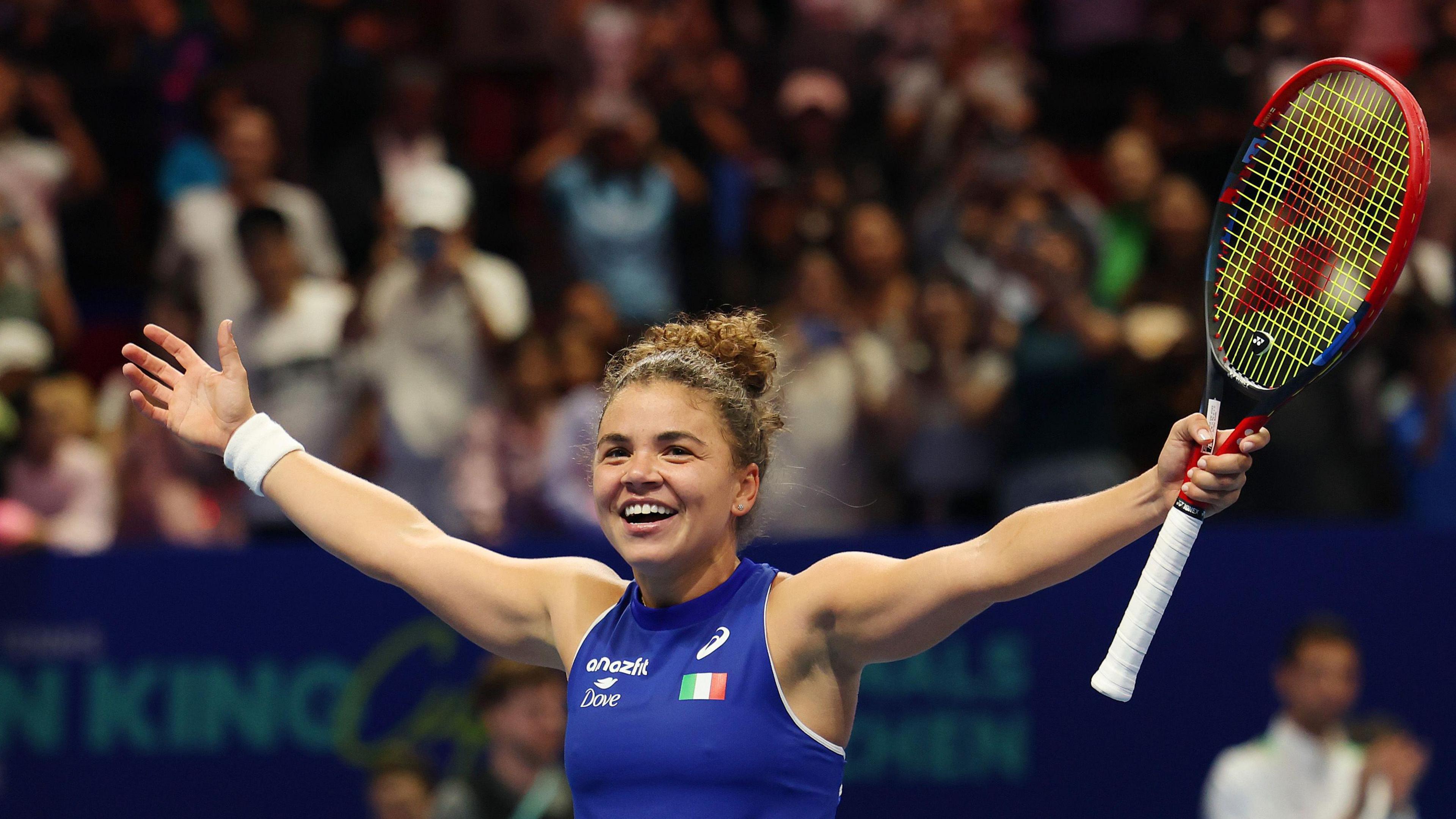 Jasmine Paolini celebrates beating American Jessica Pegula and winning the BJK Cup trophy for Italy