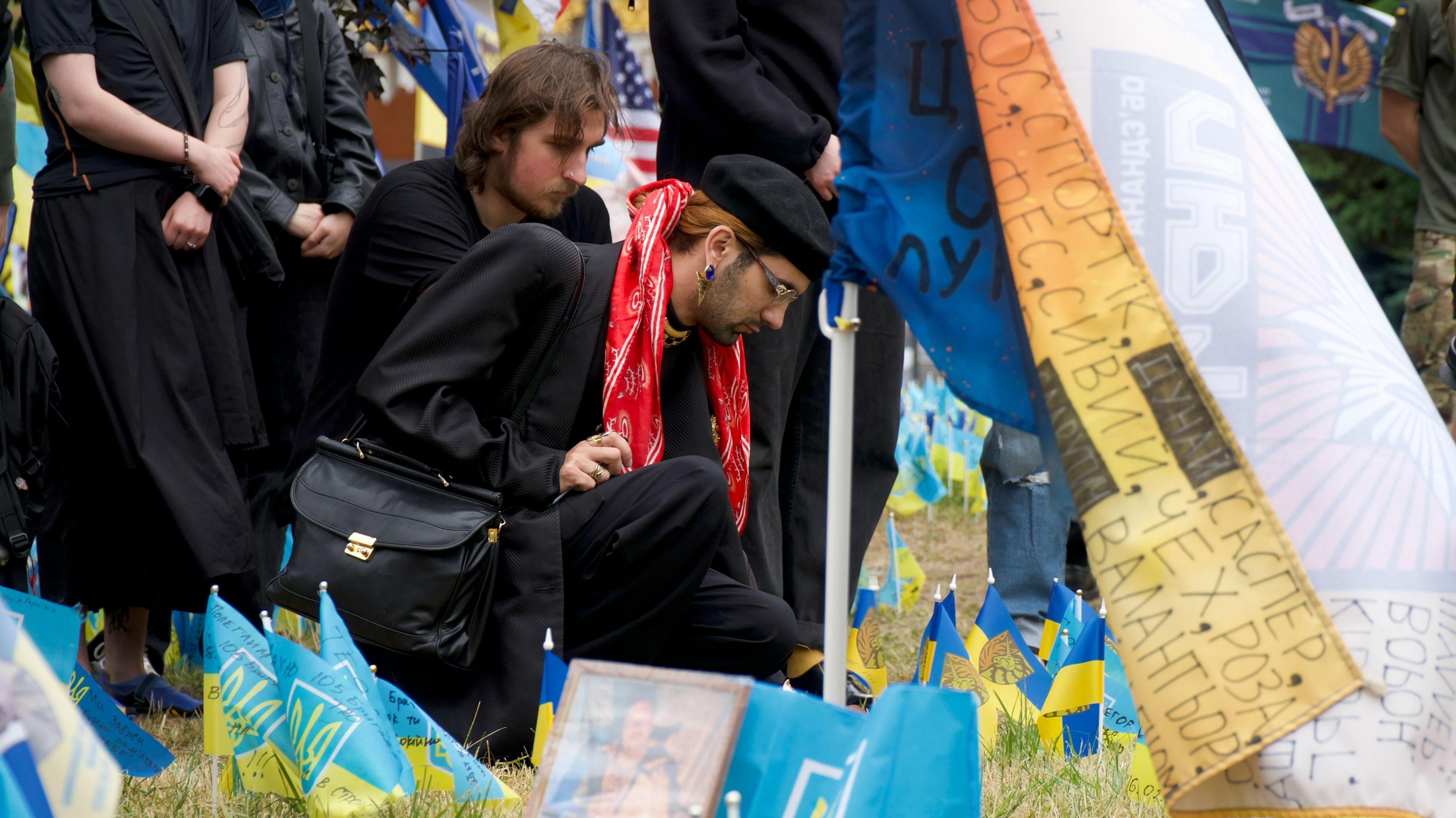 Rodion is pictured placing a flag