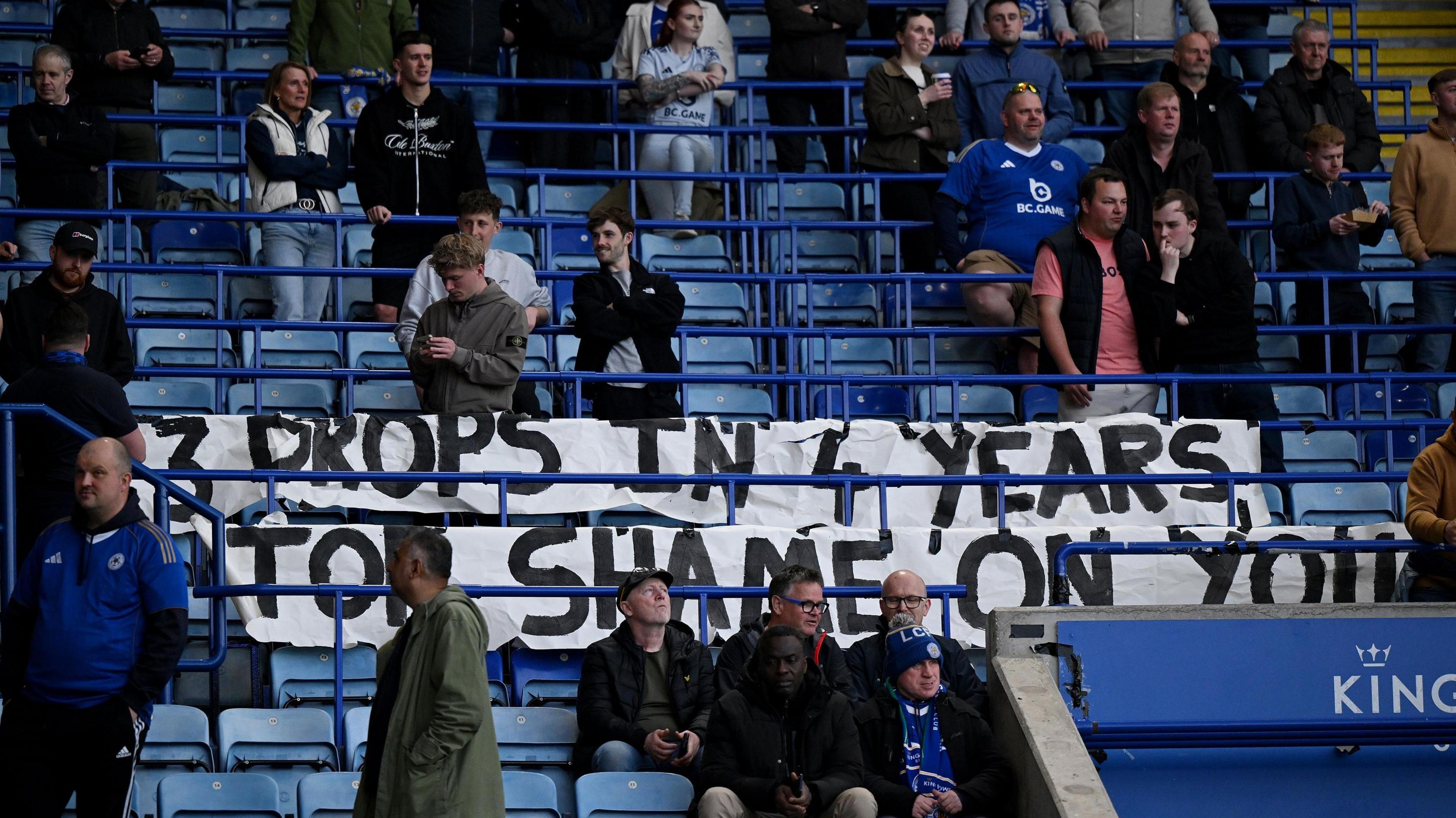 A banner that read '3 drops in 4 years, Top shame on you' was unfurled by one section of Leicester supporters in the ground