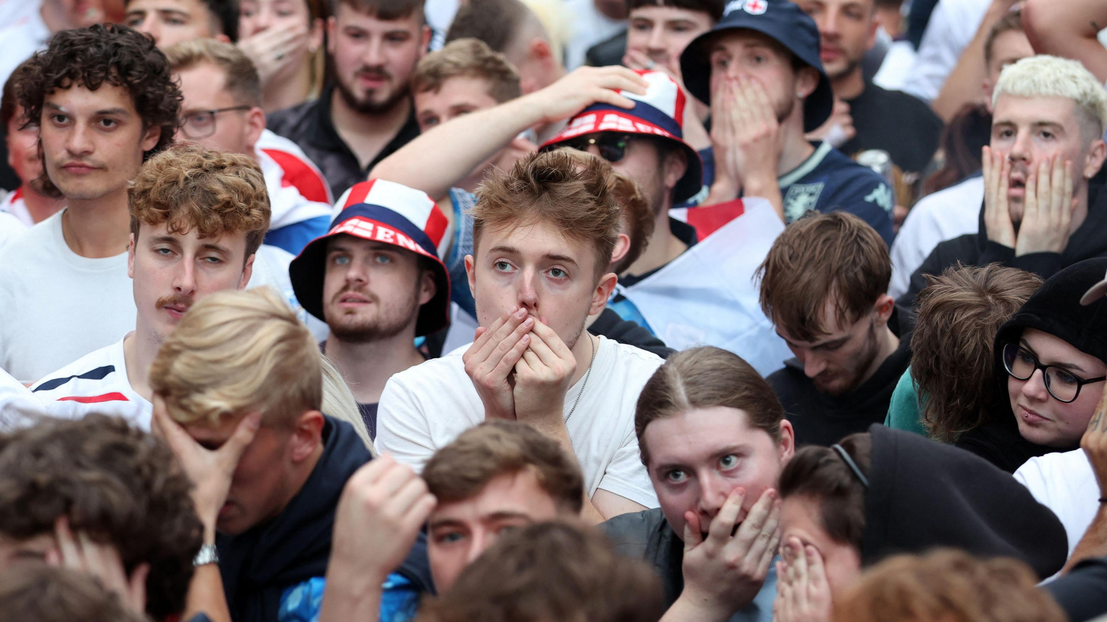 England fans in Manchester watch Euro 2024 final with hands on their faces