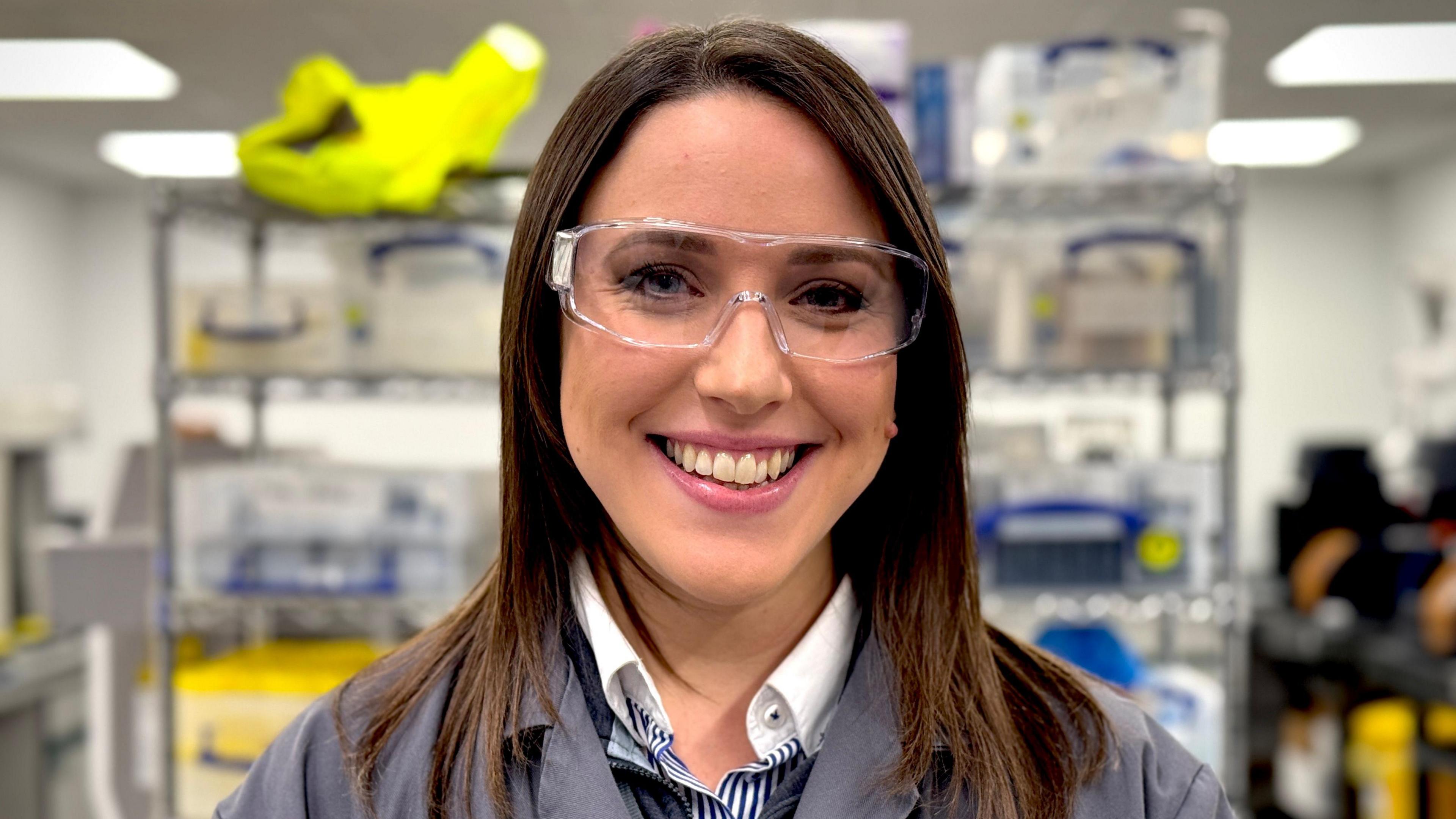 Ellie Gallanis, wearing a lab coat and goggles in Levidian's Cambridge lab