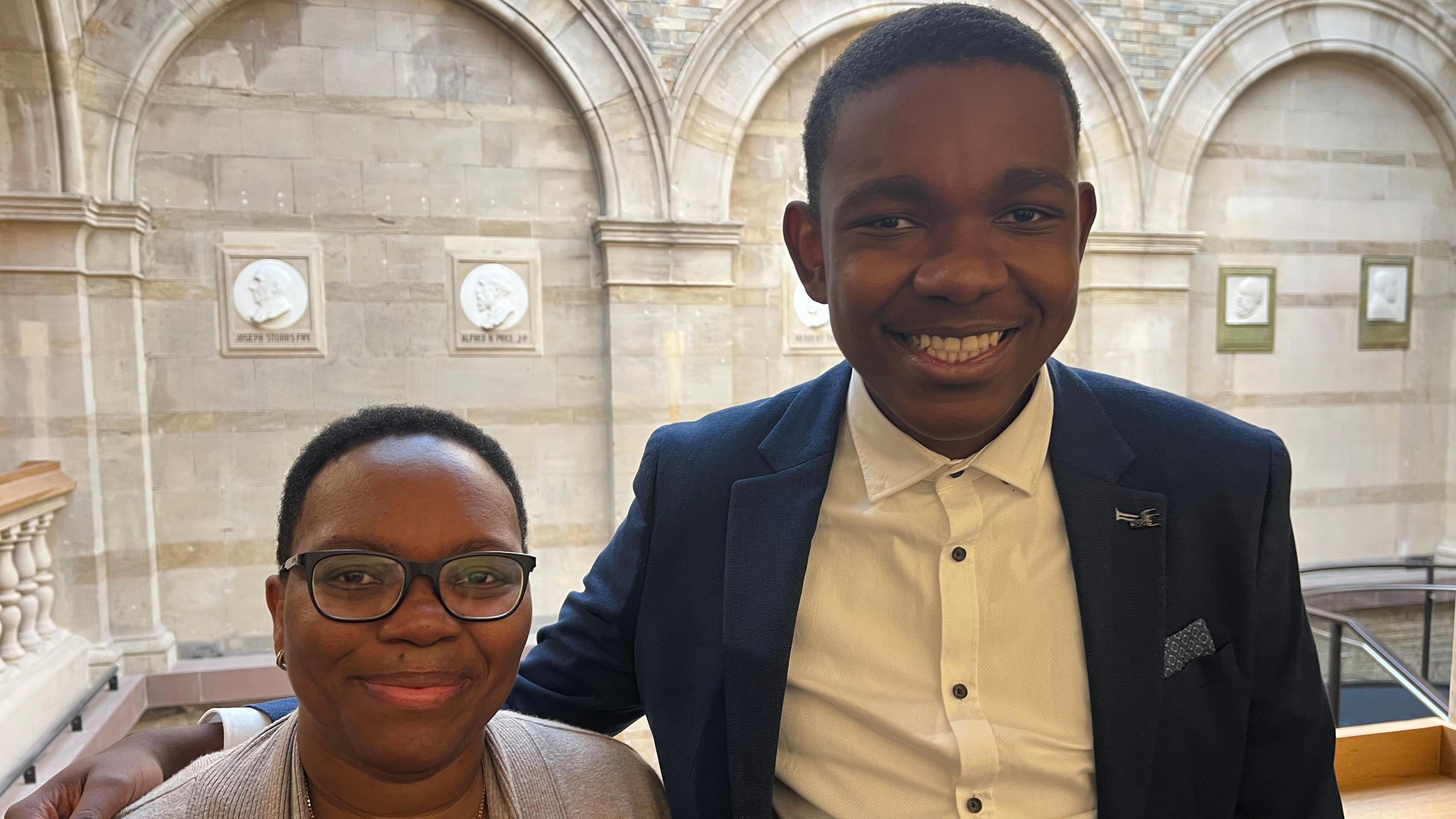 Lakhile stands with his mother Bonsile on the balcony of the Bristol Beacon.