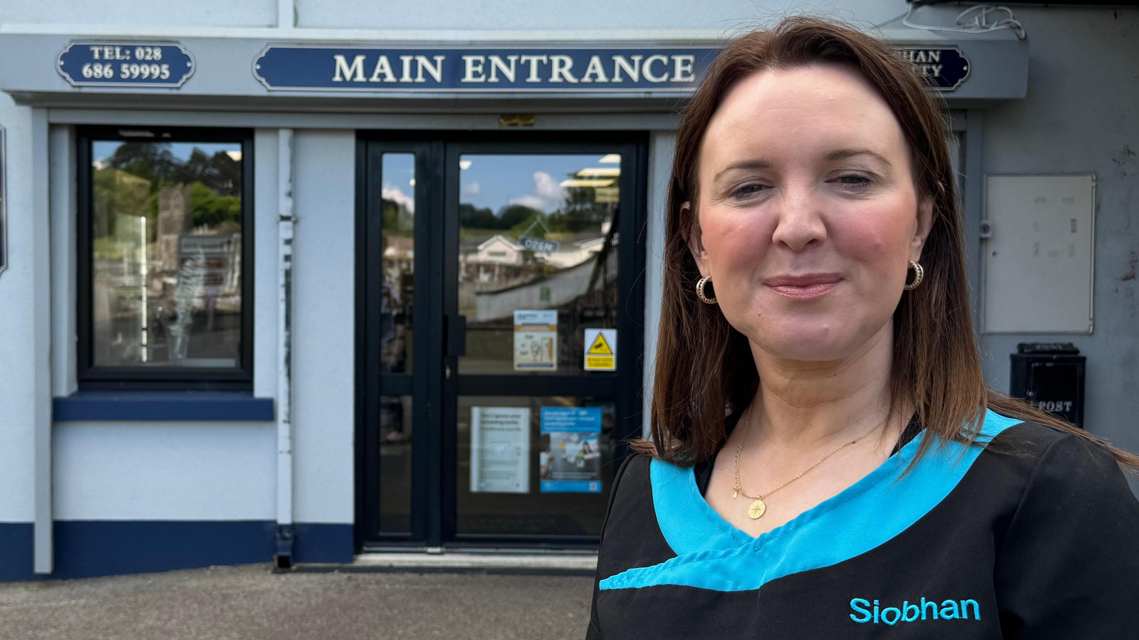 Siobhan McNulty standing outside her pharmacy