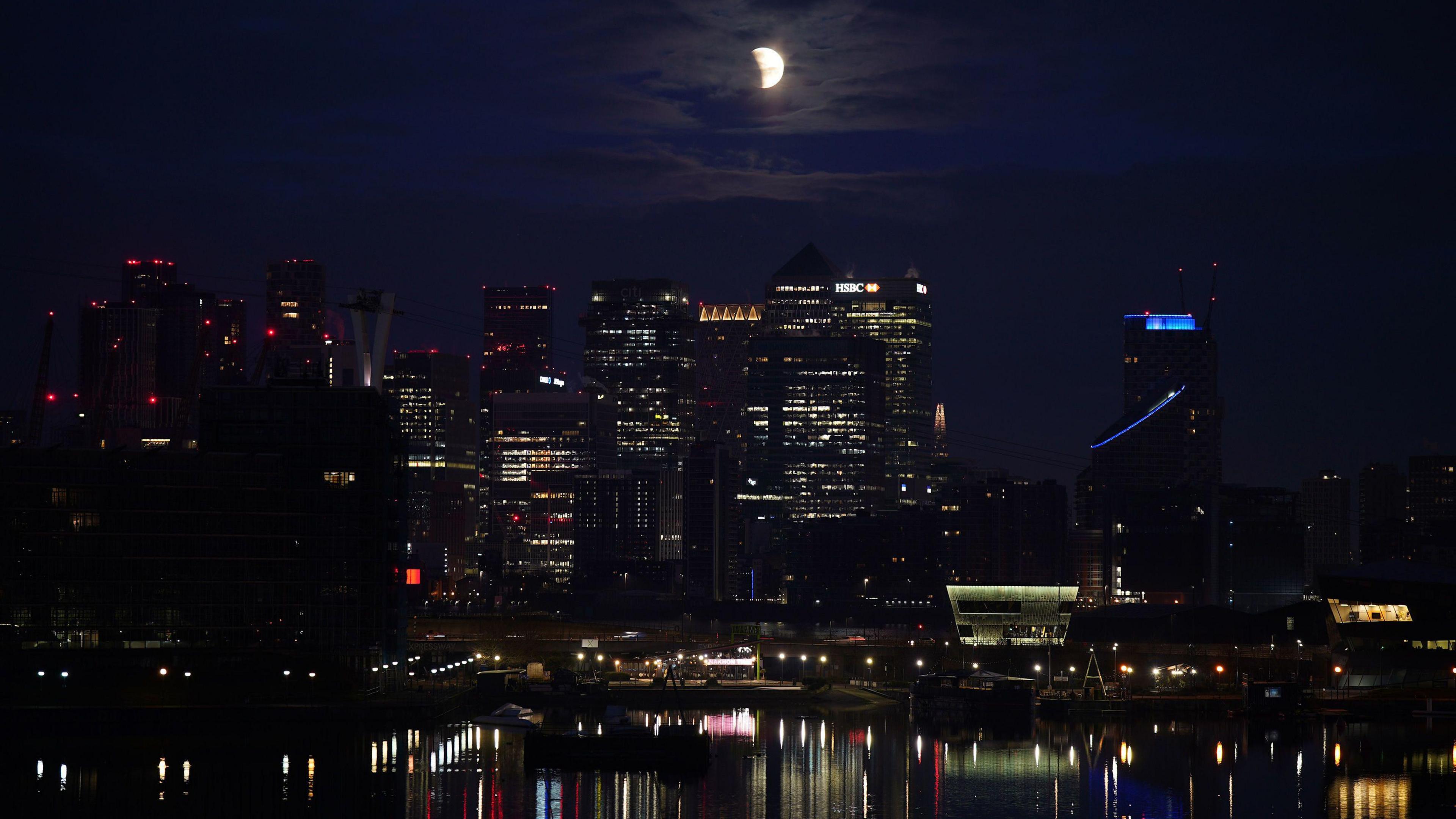 Partial eclipse above London's Canary Wharf.