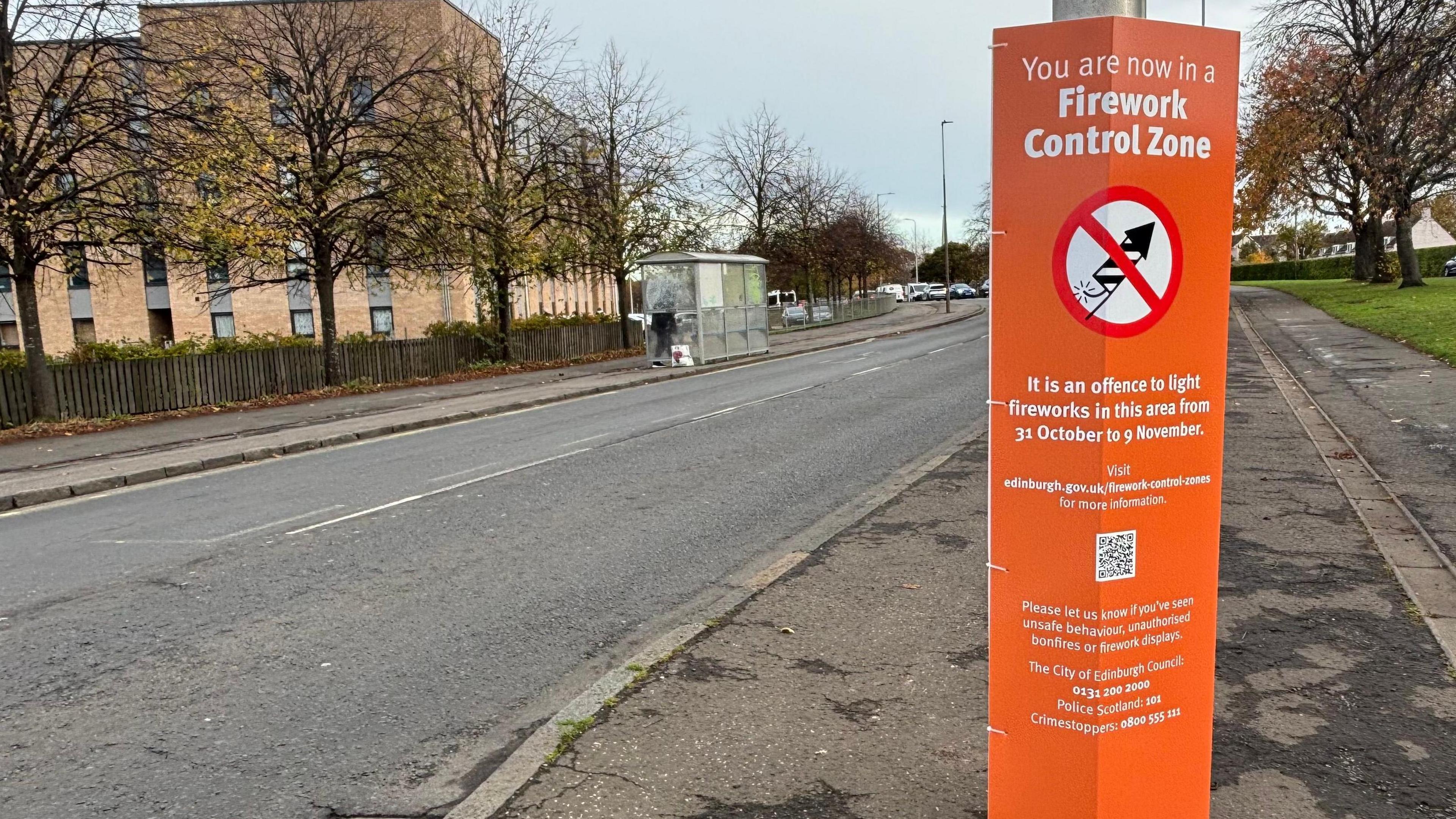 An orange sign at the start of the FCZ in Niddrie, Edinburgh.