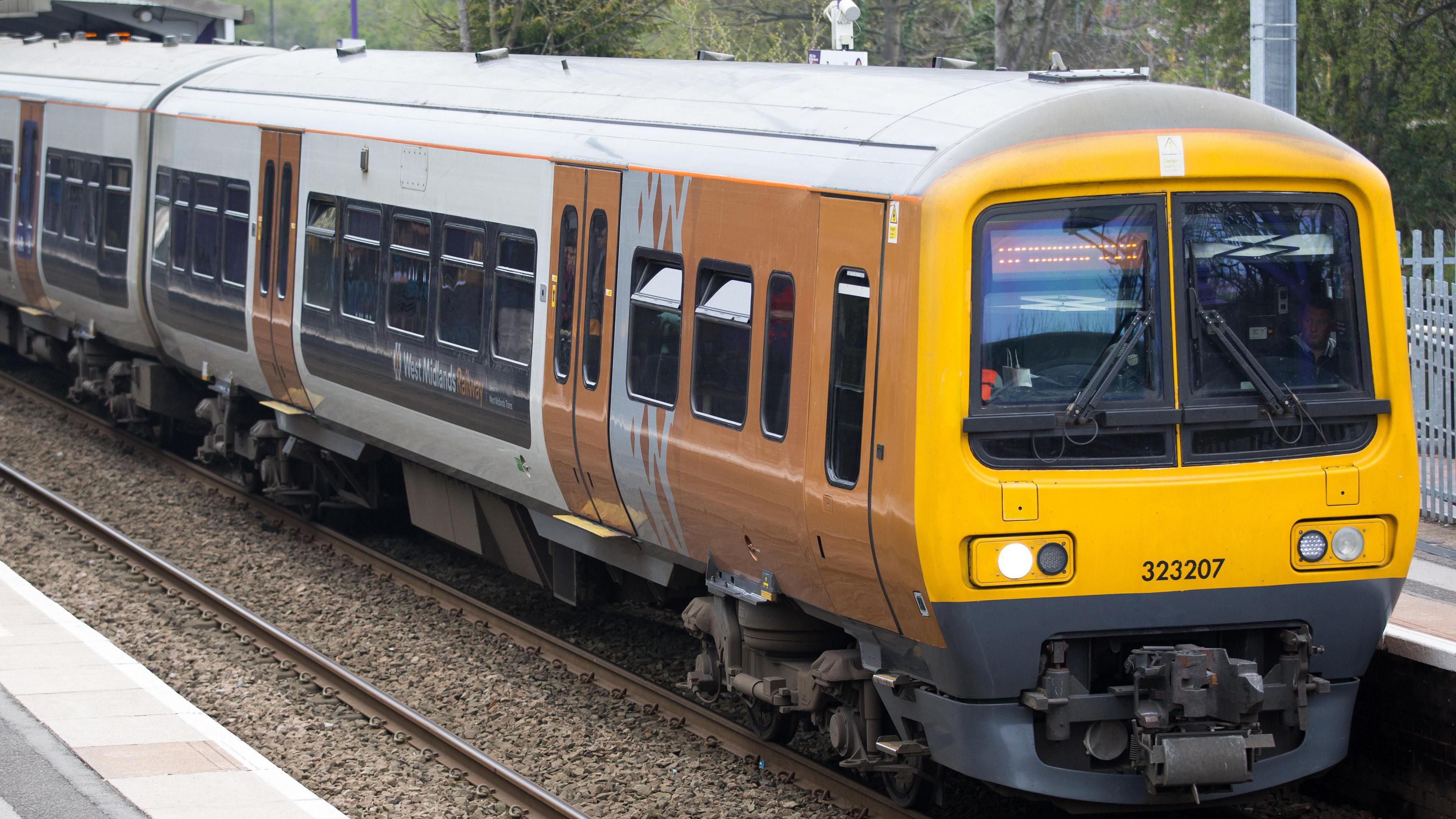 A West Midlands Railways train at a station