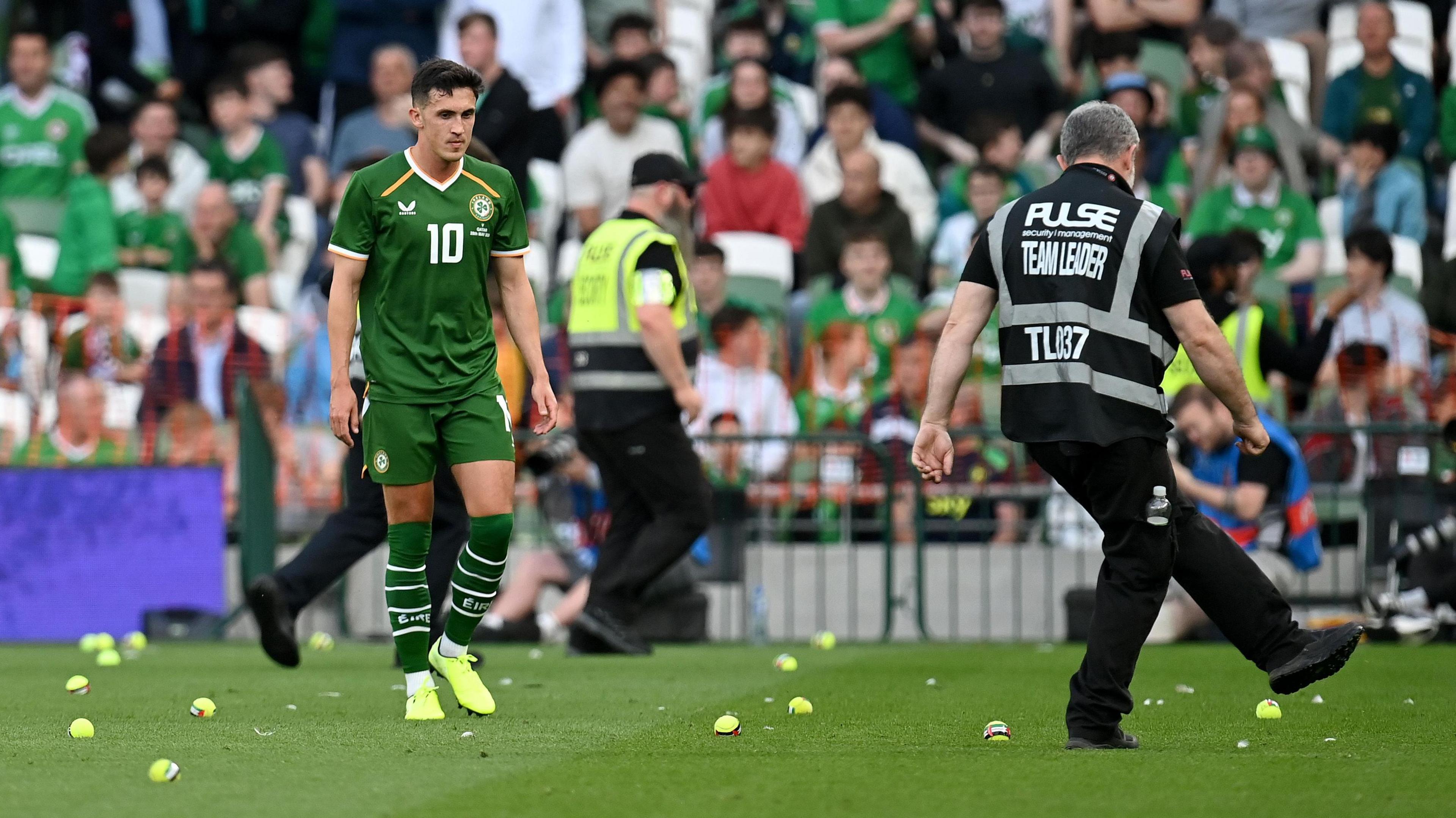 Tennis balls are cleared off the Aviva Stadium pitch