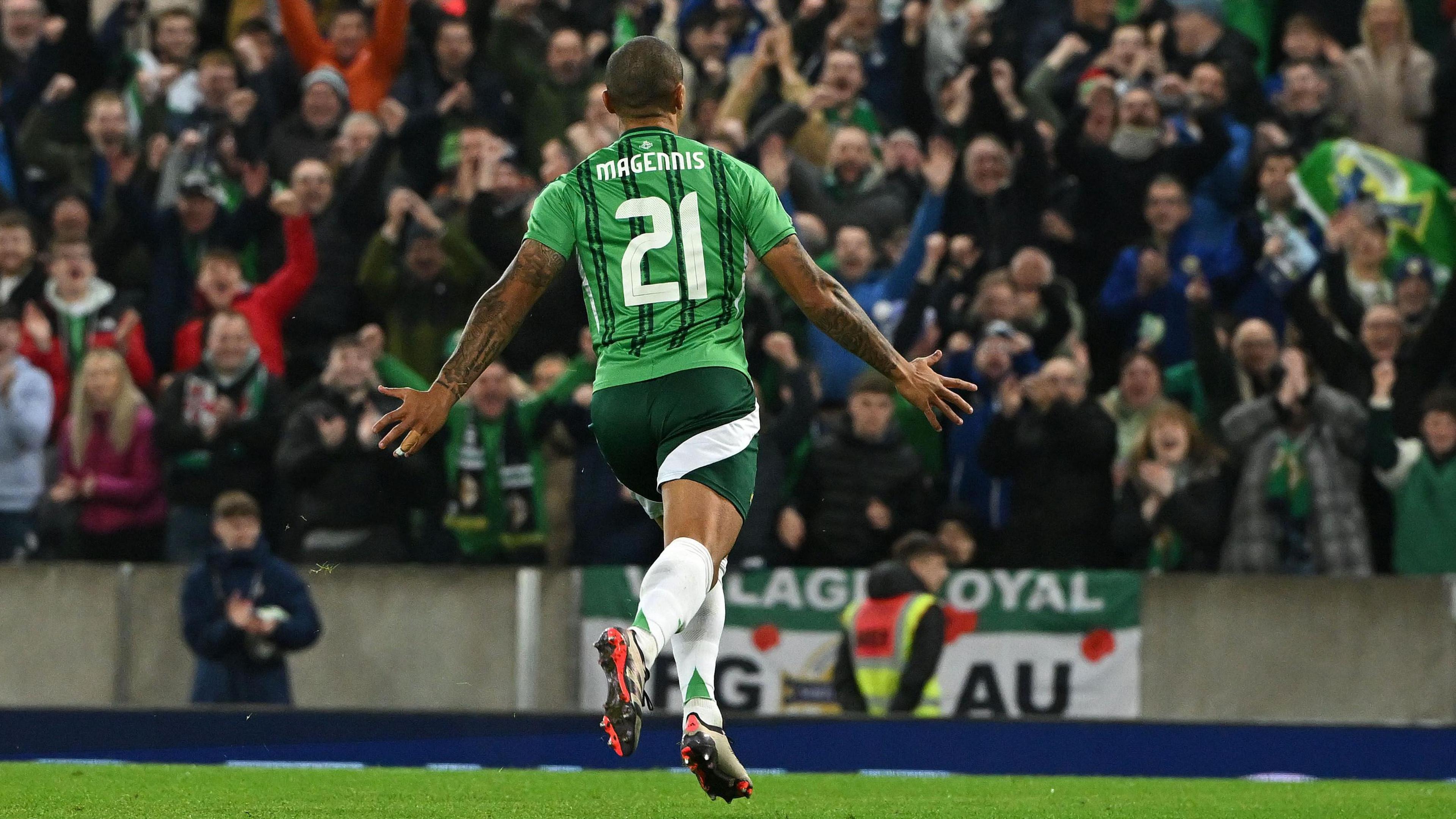 Josh Magennis celebrates scoring a goal for Northern Ireland at Windsor Park
