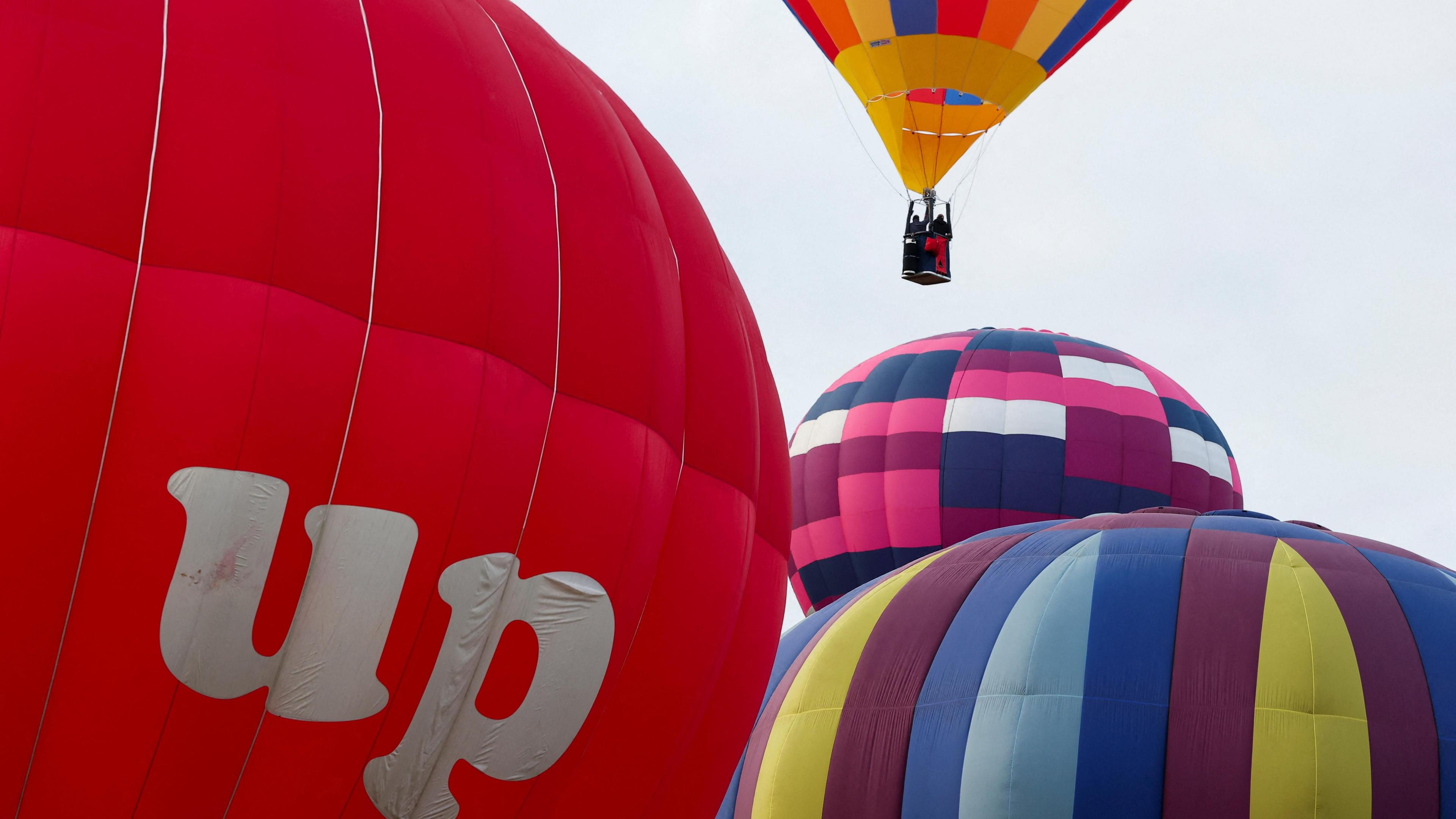 Several Balloons inflated and taking off
