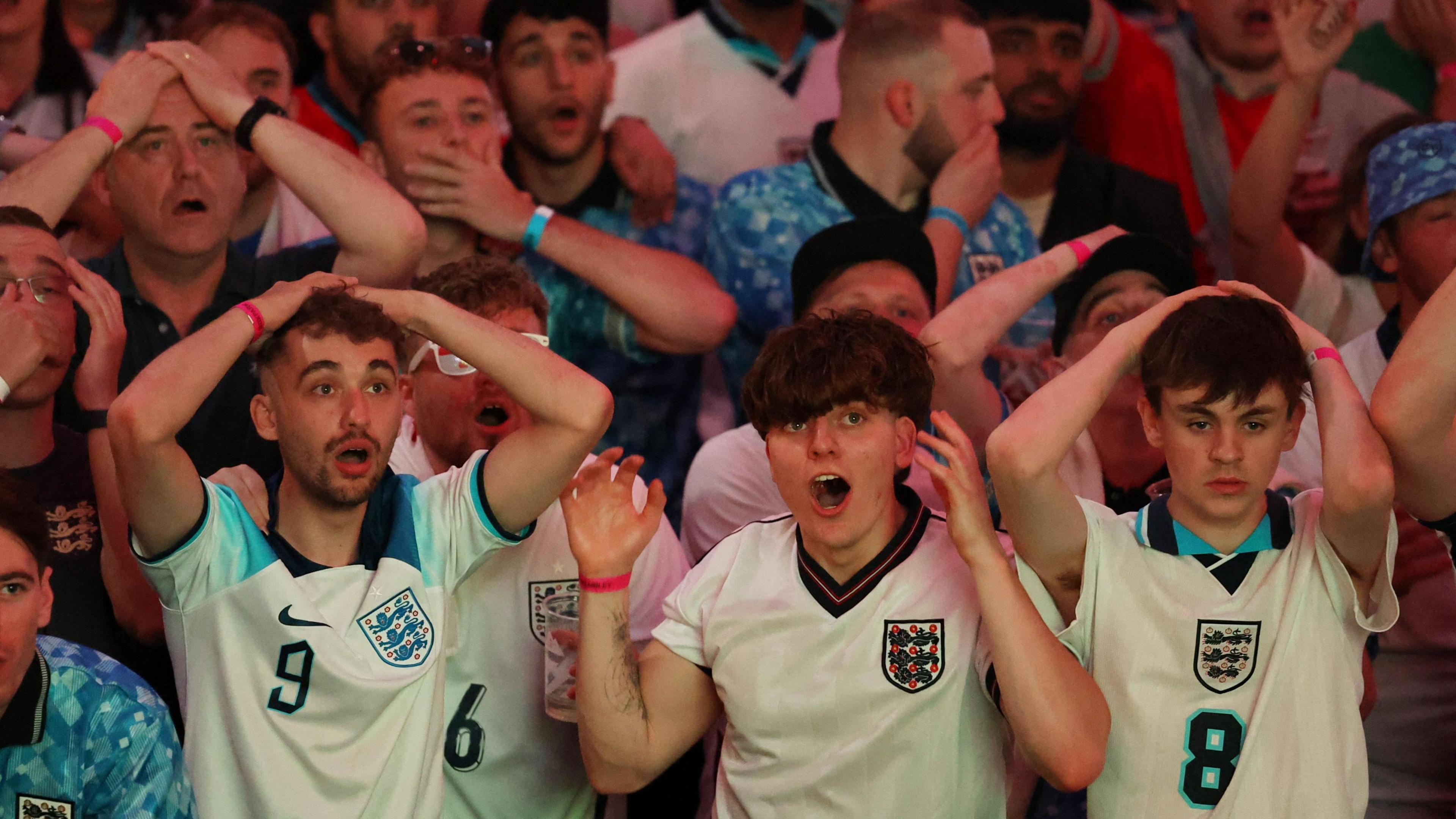 England fans at BoxPark Wembley react during the match as England's Harry Kane hits the crossbar.