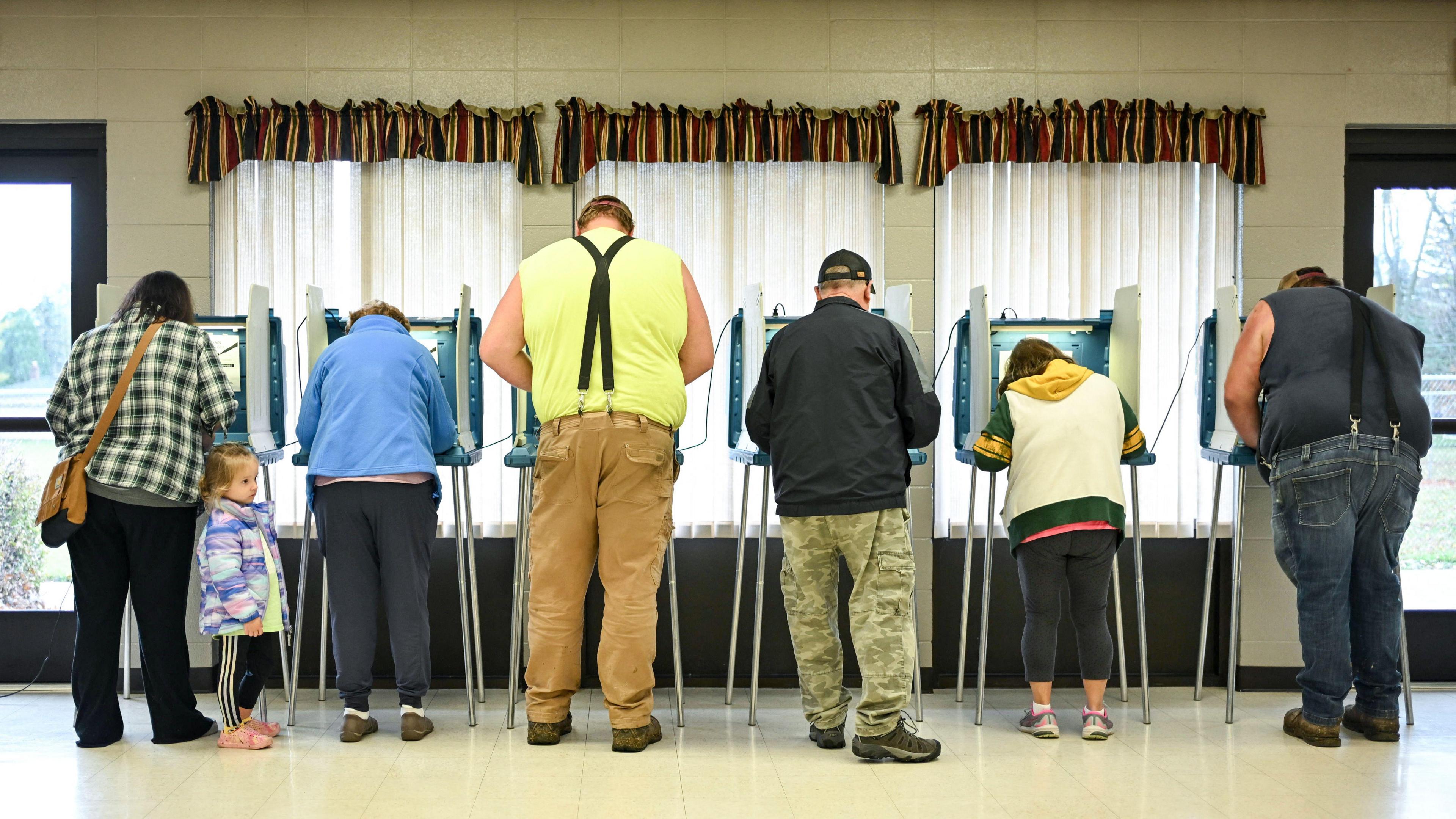 People vote at a polling station at Addison Town Hall in Allenton, Wisconsin, on Election Day, 5 November, 2024. 