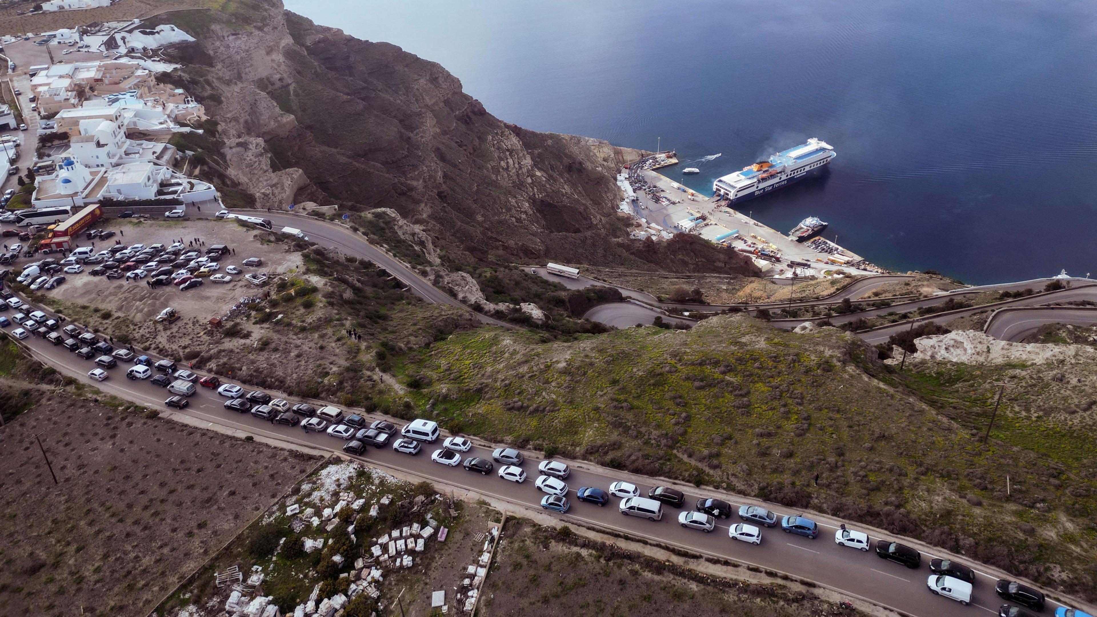 A line of cars on Santorini waiting to leave the island.