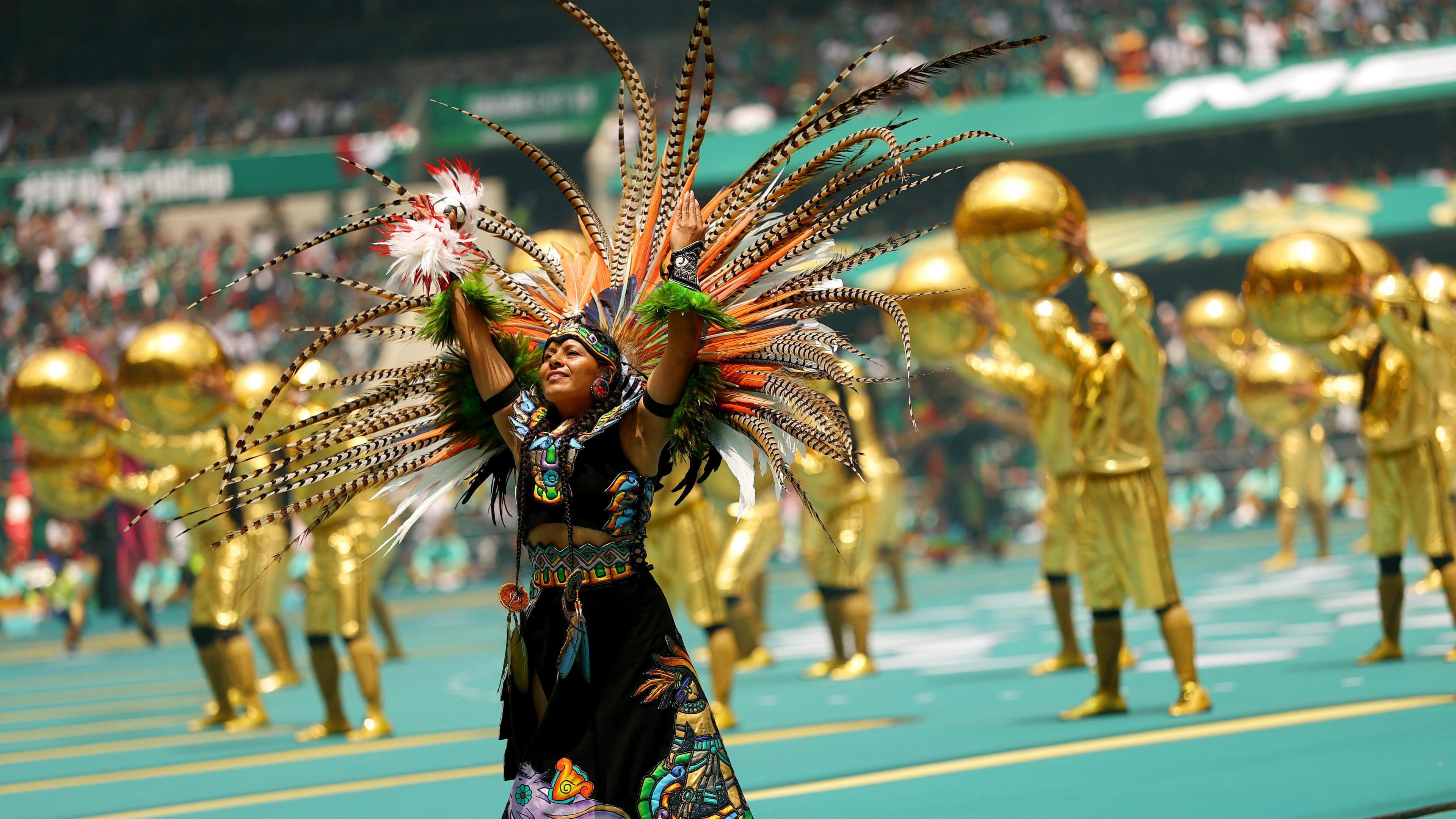 Performers during the opening ceremony before the match.