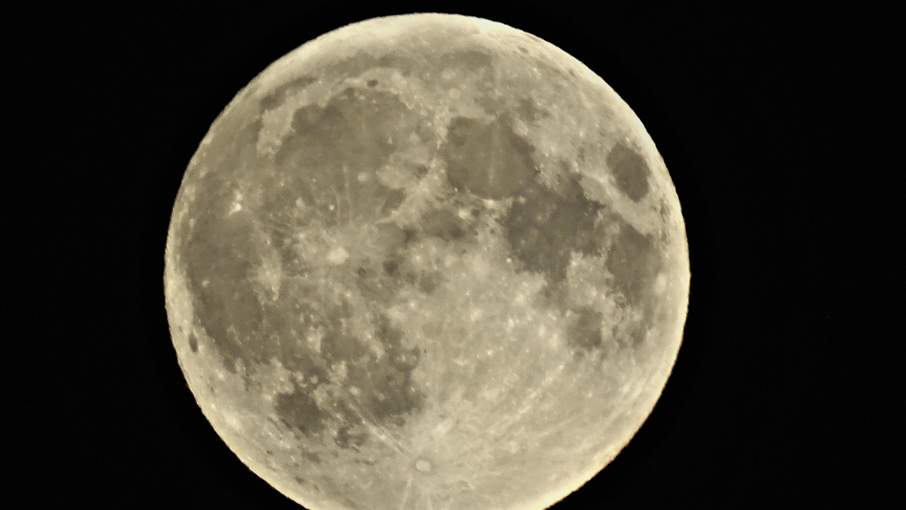 Craters on the moon could be seen in greater detail through a telescope