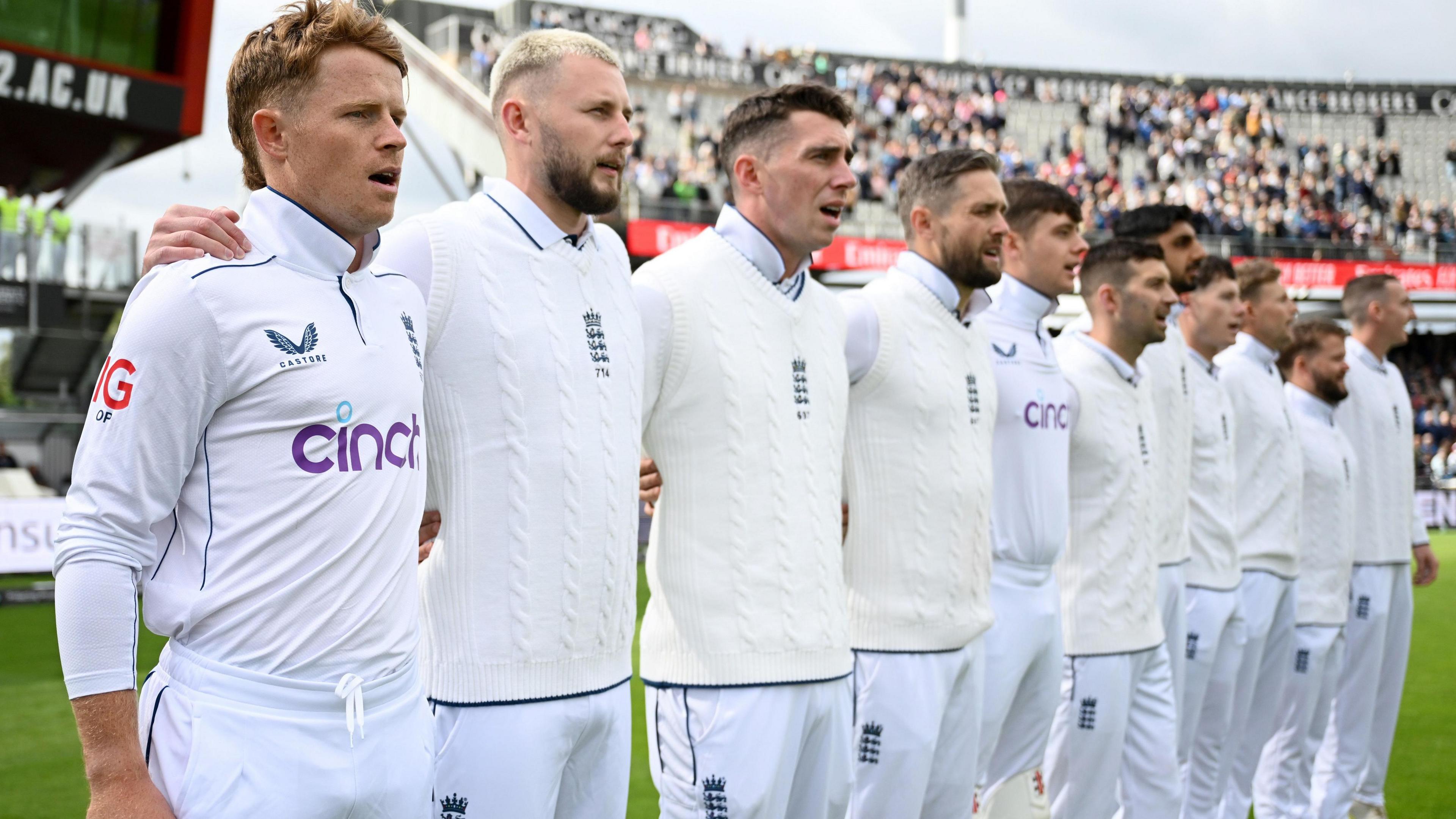 The England team stand in line before a Test