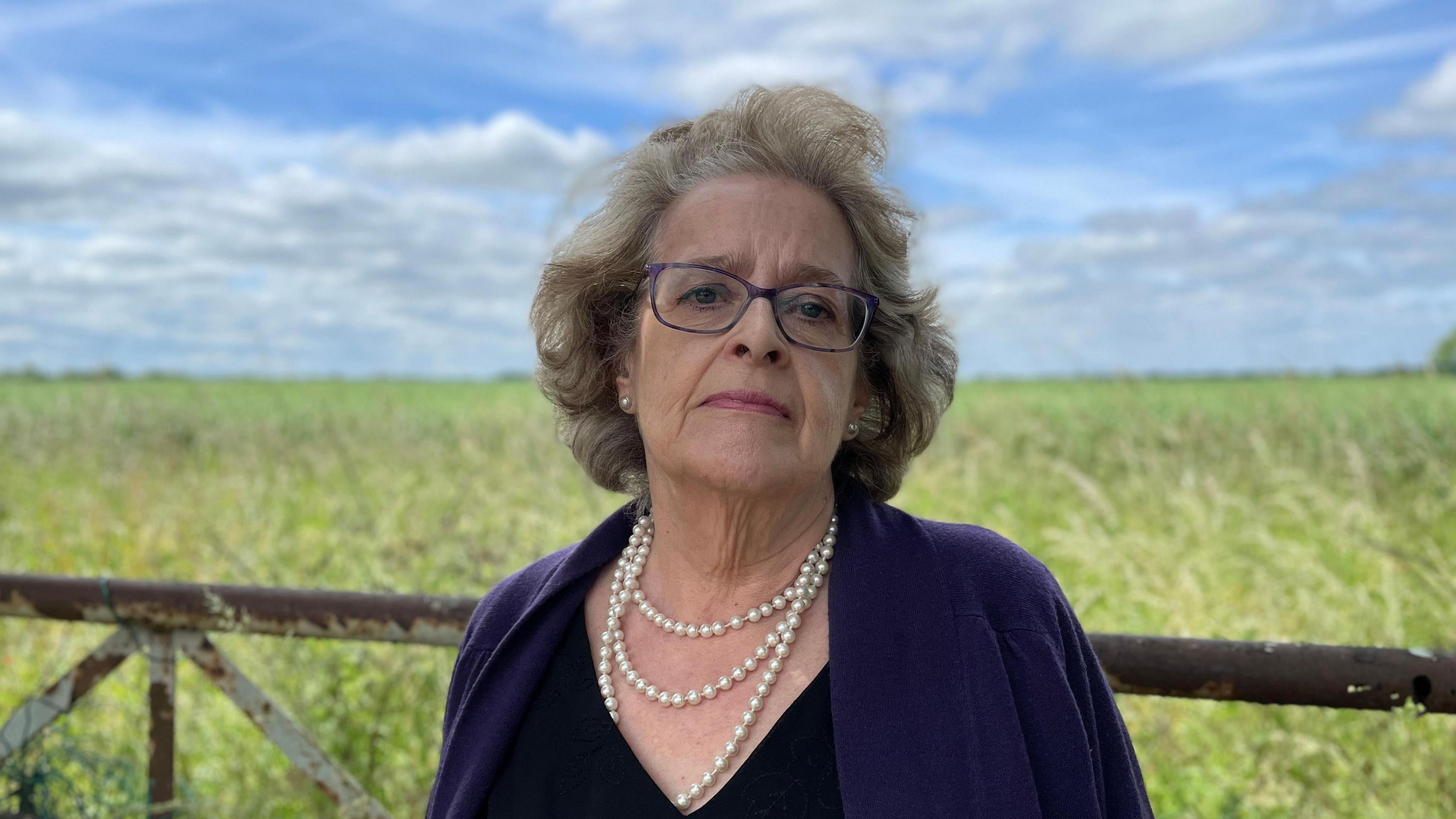 Lorna Sorrentino standing in front of a field