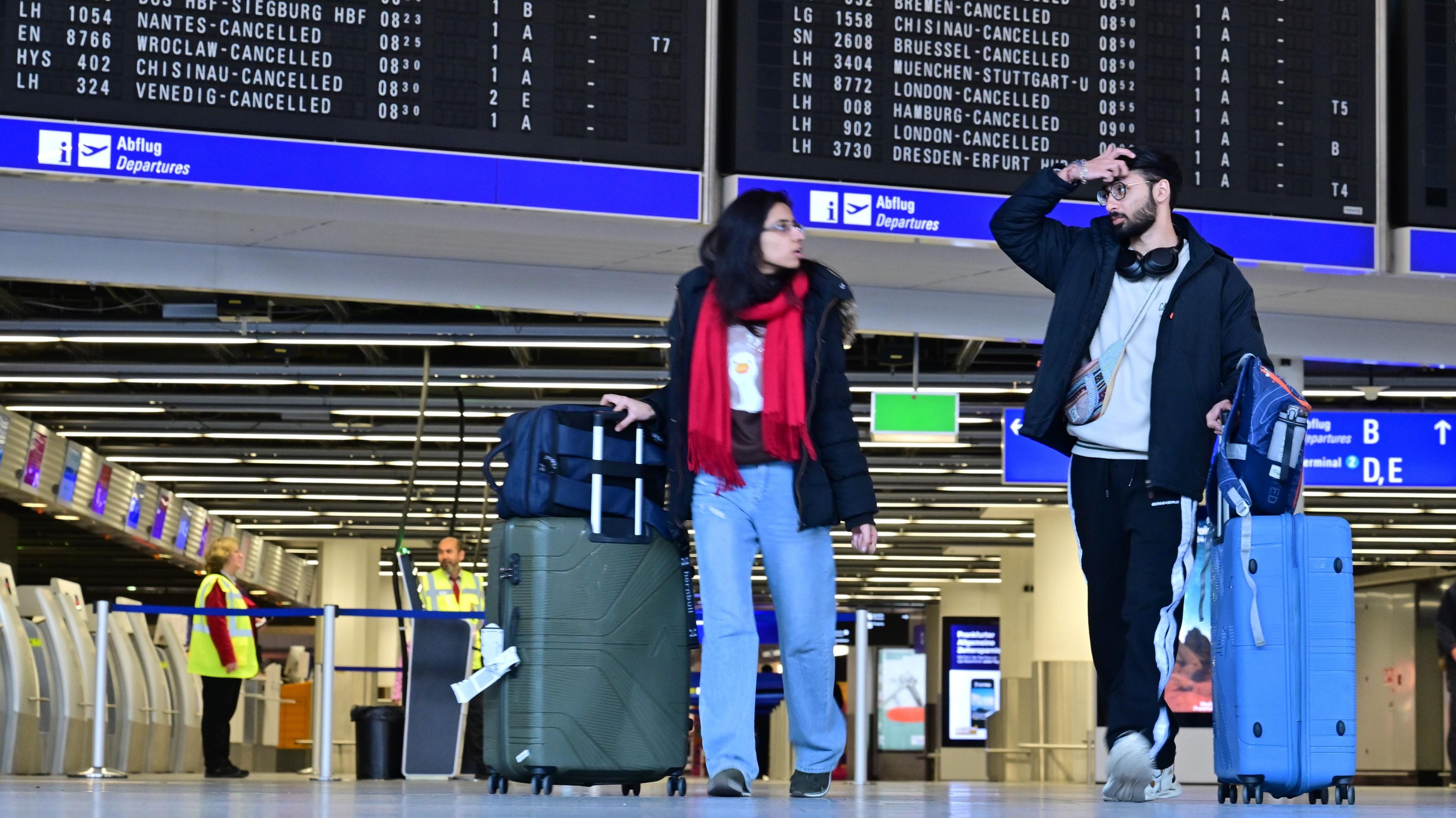 Passengers wait at Frankfurt Airport on March 10, 2025 in Frankfurt, Germany.