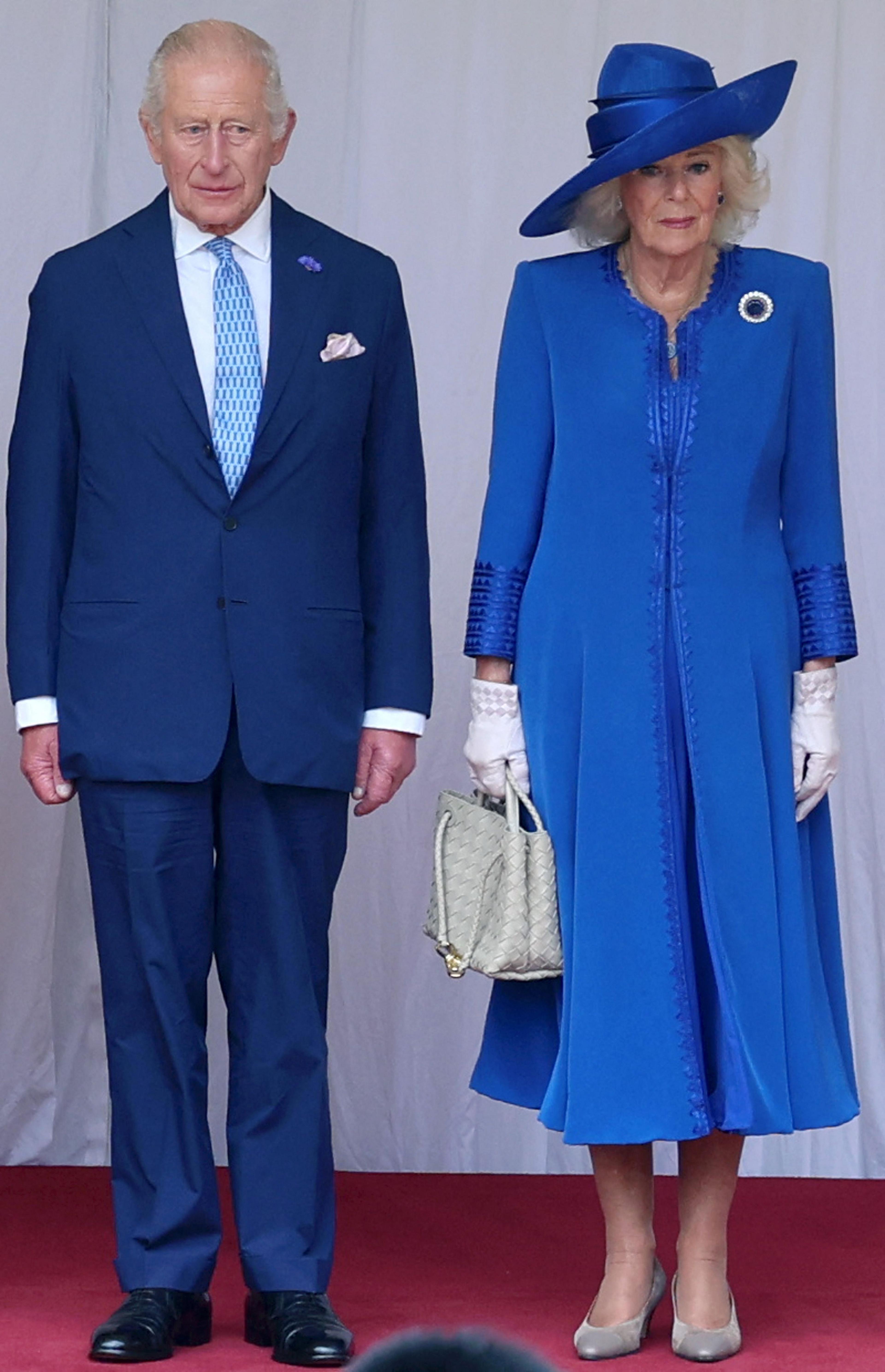 Britain's King Charles III and Britain's Queen Camilla during a Ceremonial Welcome in the Quadrangle at Windsor Castle

