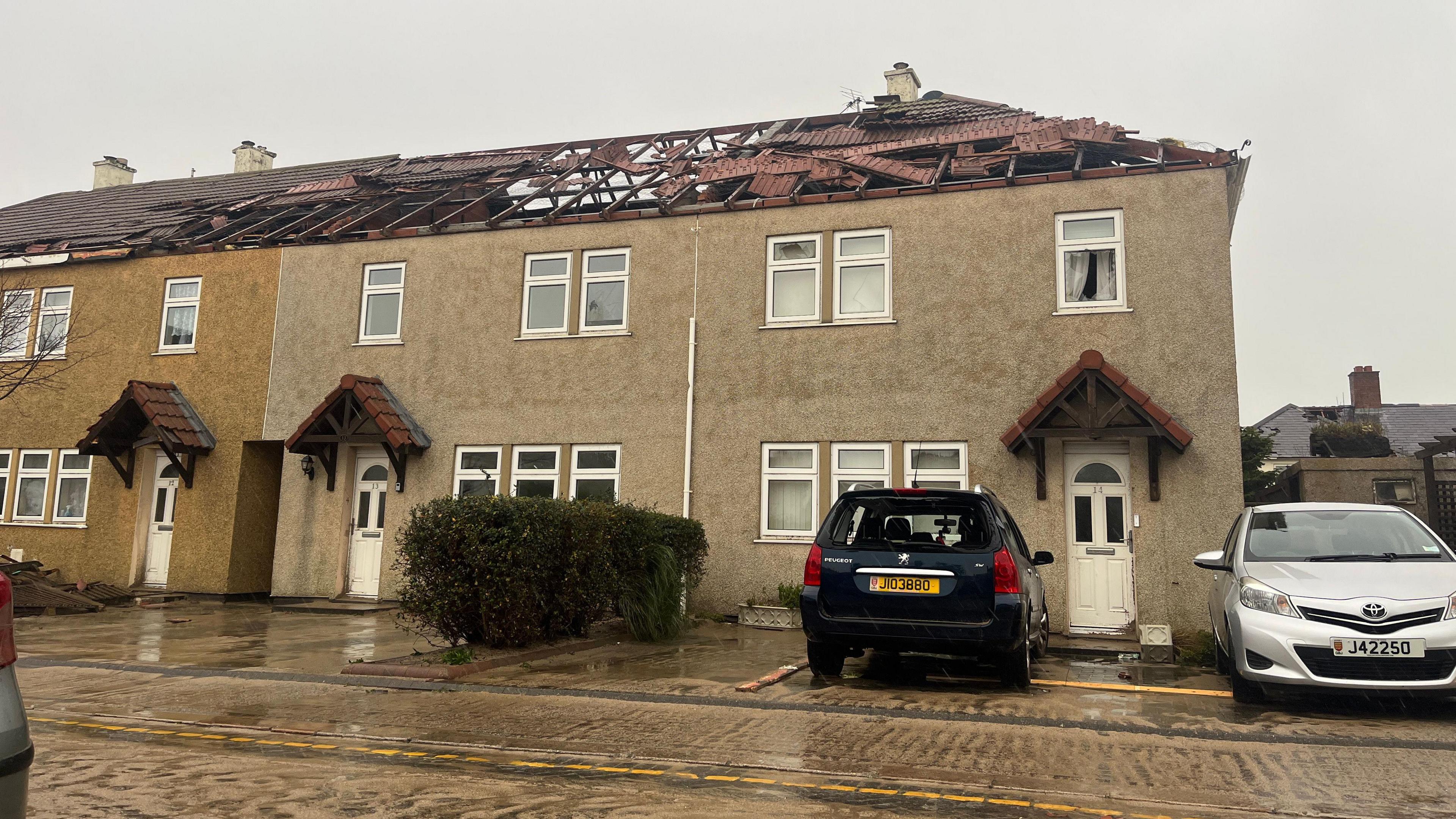 Image of a house in St Clement with the roof ripped off