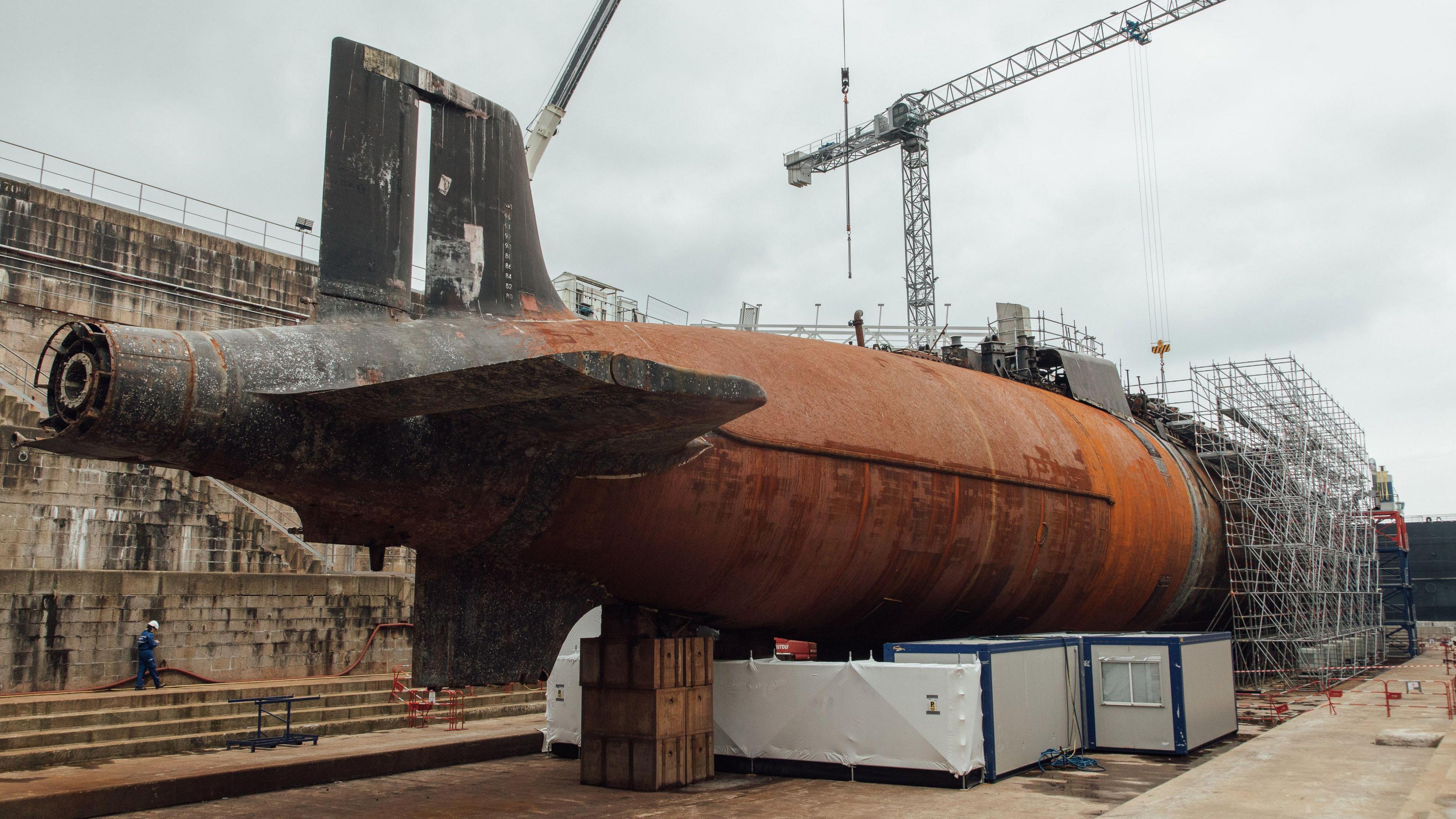 Submarine in dry dock with scaffolding in place