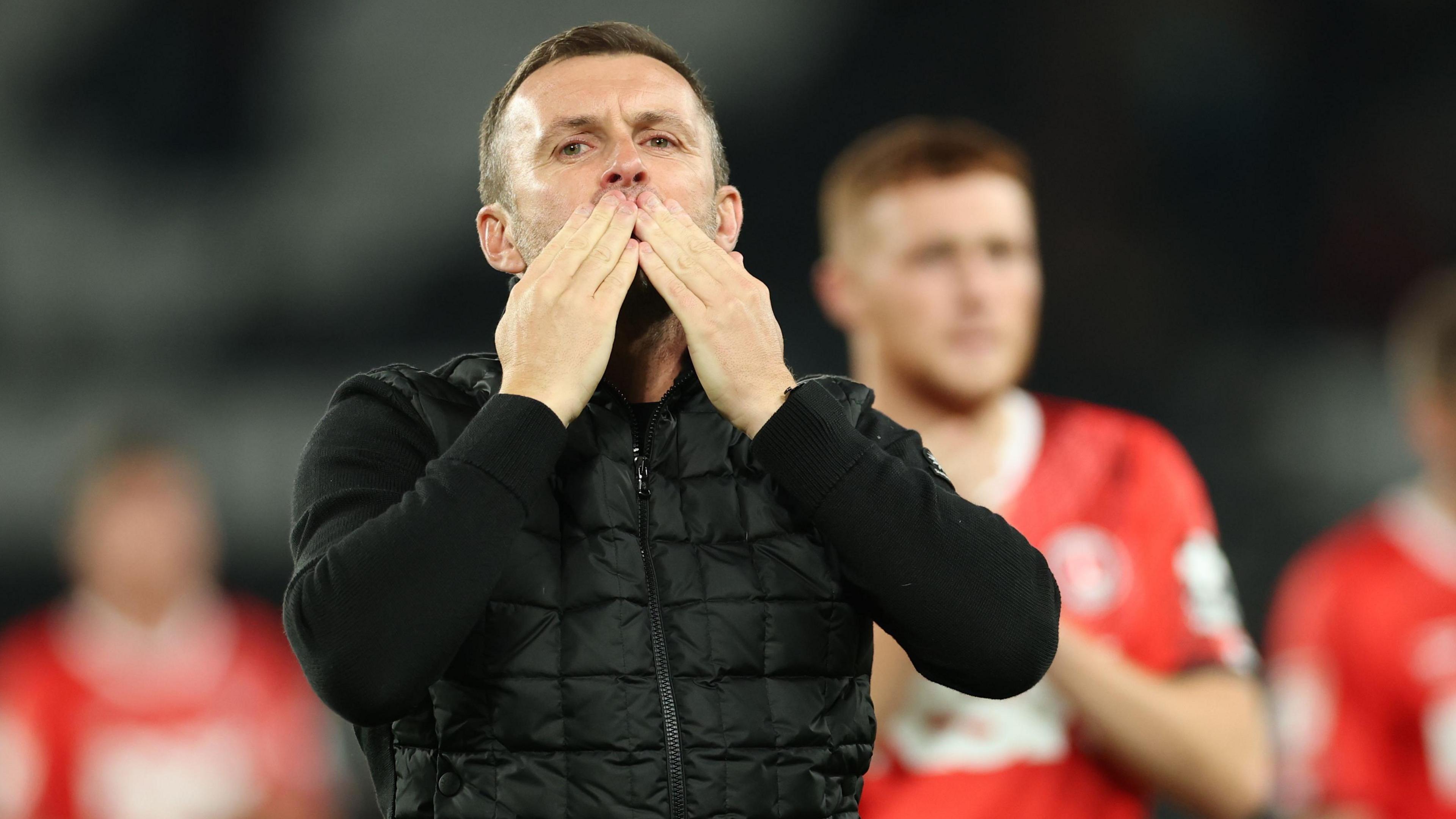Nathan Jones blows kisses to the Charlton fans