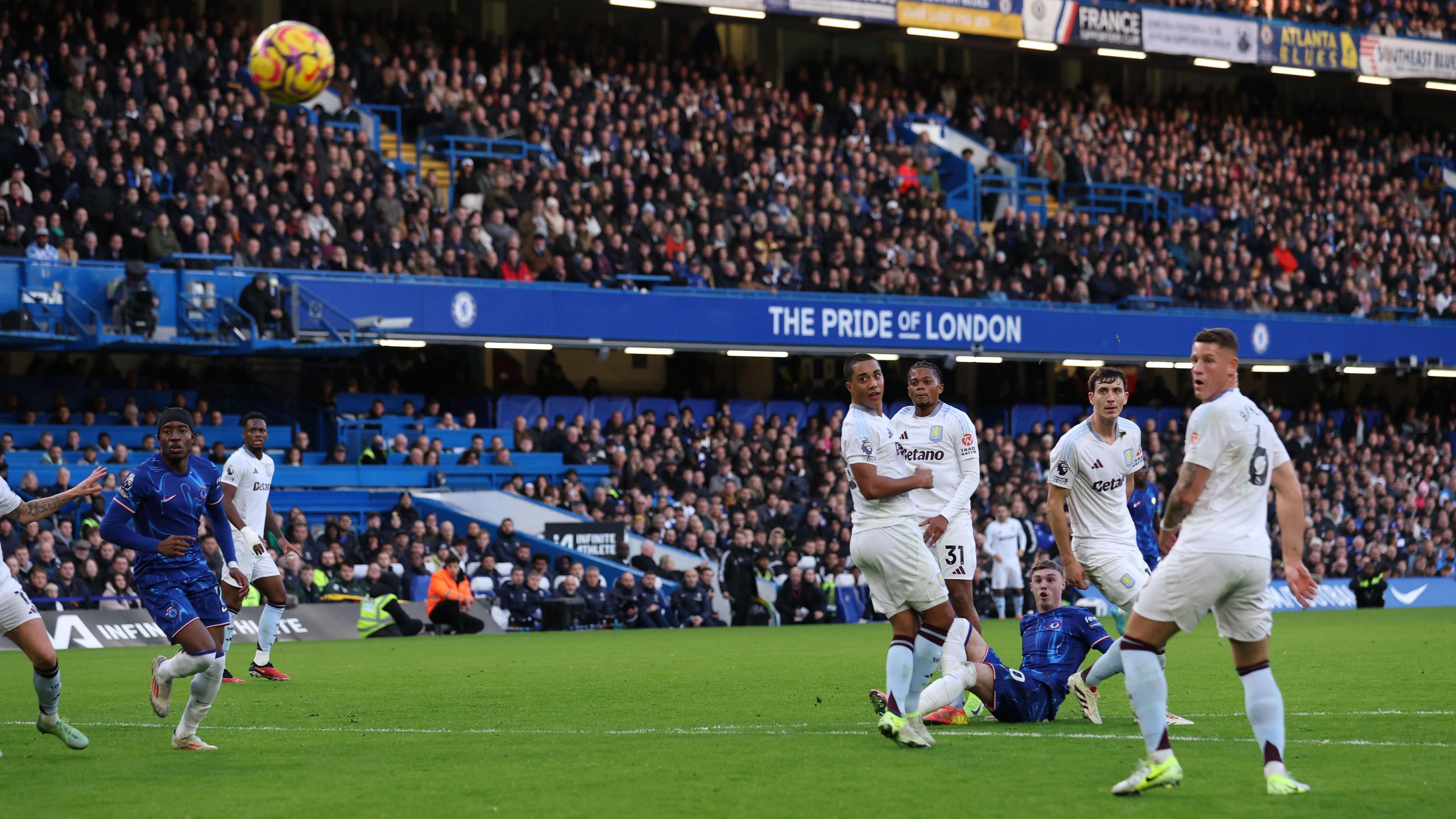 Cole Palmer of Chelsea scores his team's third goal during the Premier League match between Chelsea FC and Aston Villa FC at Stamford Bridge