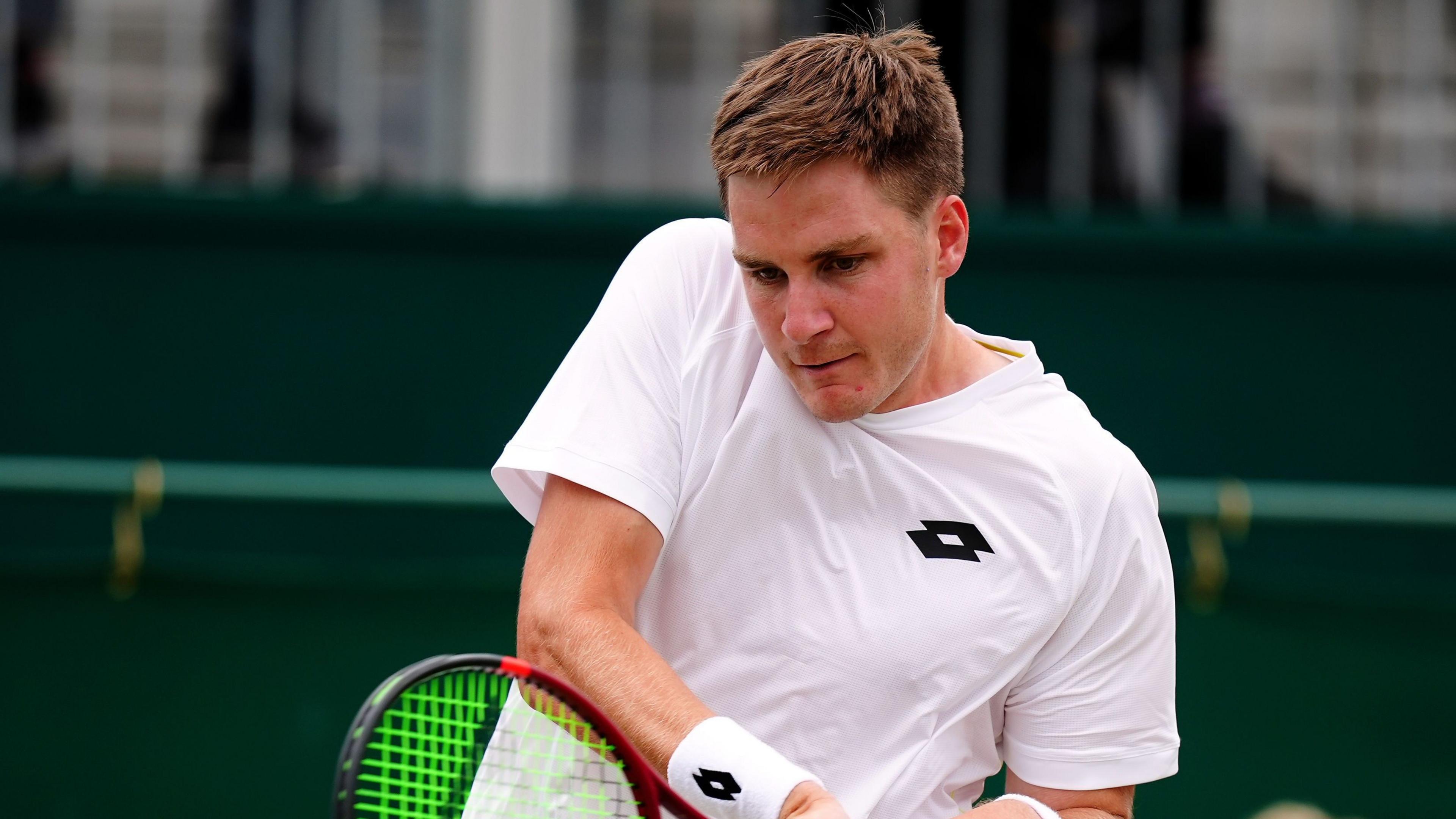 Henry Patten playing tennis at Wimbledon