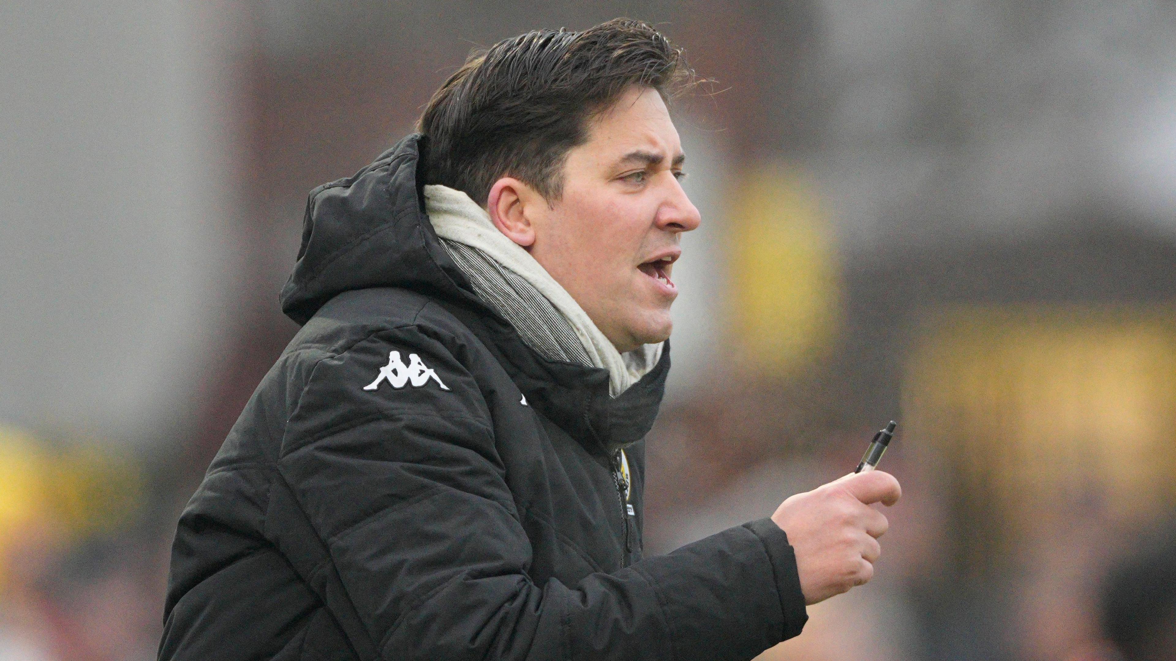 Horsham manager Dominic Di Paola delivers instructions to his players from the sidelines