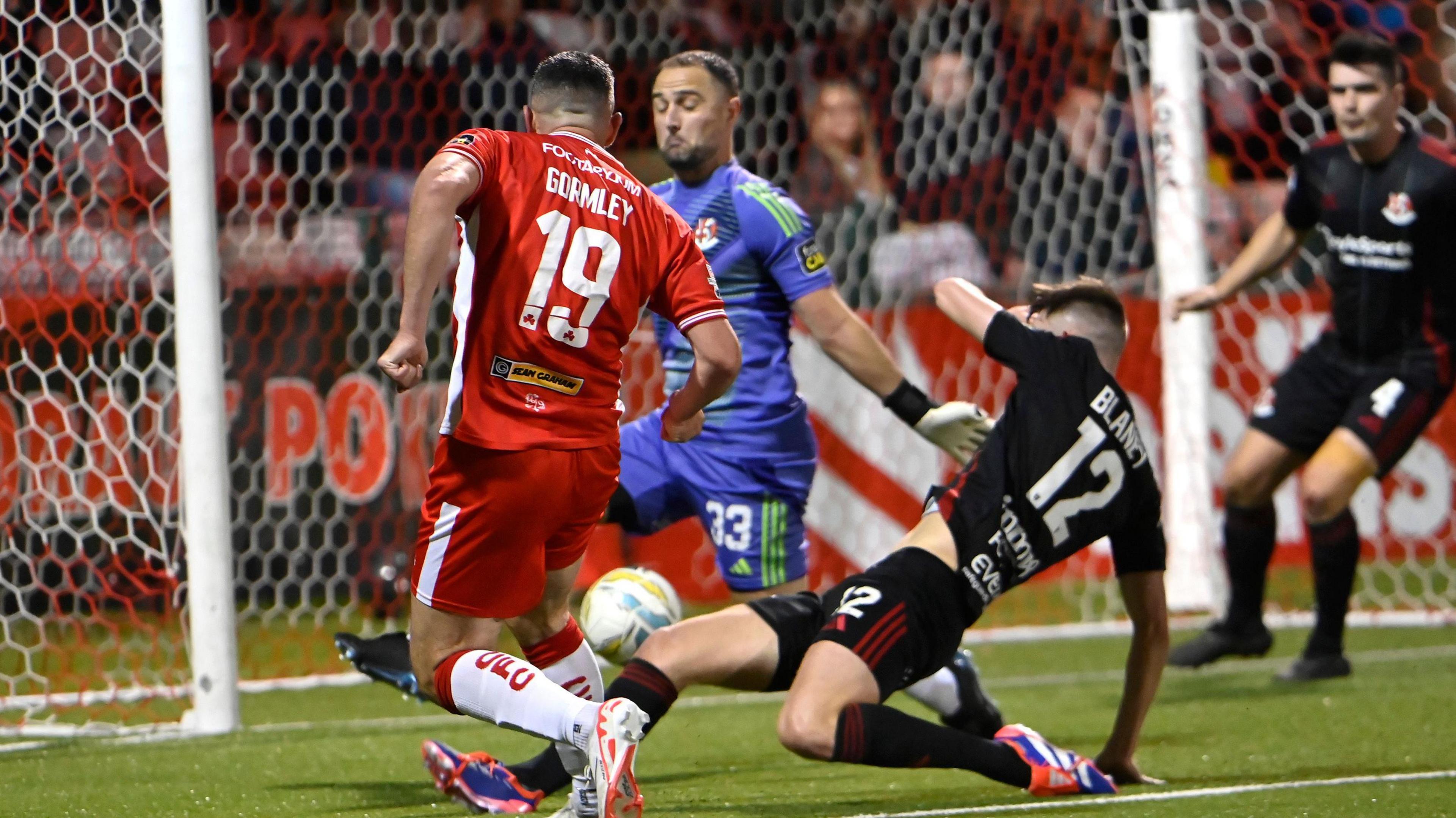 Joe Gormley scores for Cliftonville against Crusaders