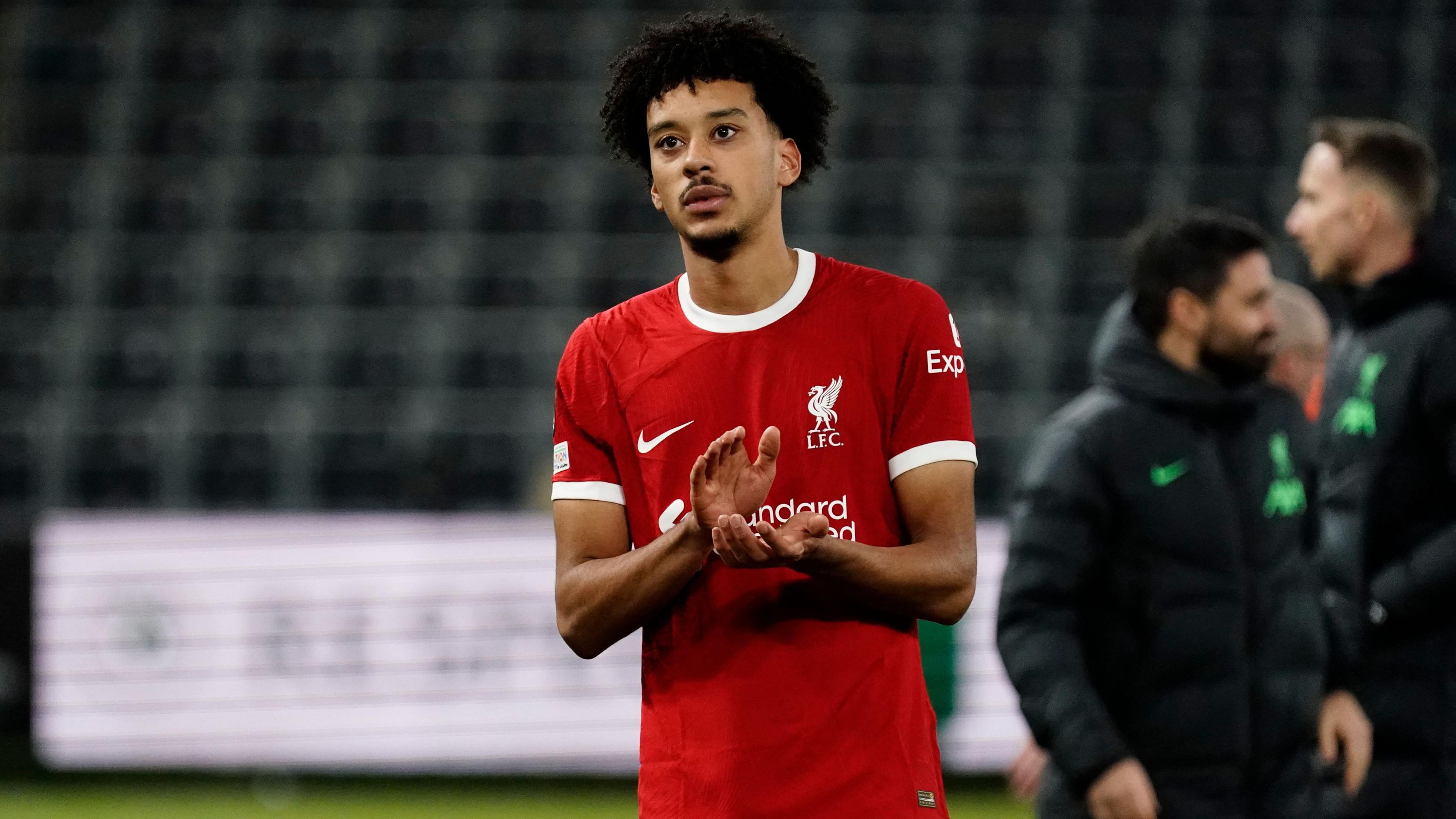 Calum Scanlon applauds the Liverpool fans