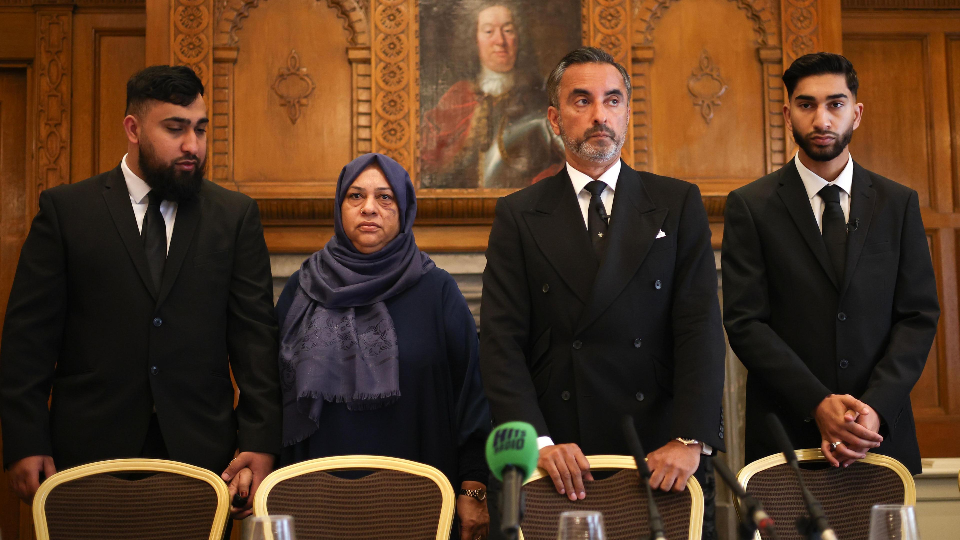 Muhammad Amaad (L) and Fahir Amaaz (R), the brothers involved in the Manchester Airport incident, their mother Shameem Akhtar (2-L), and British human rights lawyer Aamer Anwar (2-R) attend a press conference at the Midland Hotel in Manchester, Britain, 06 August 2024.