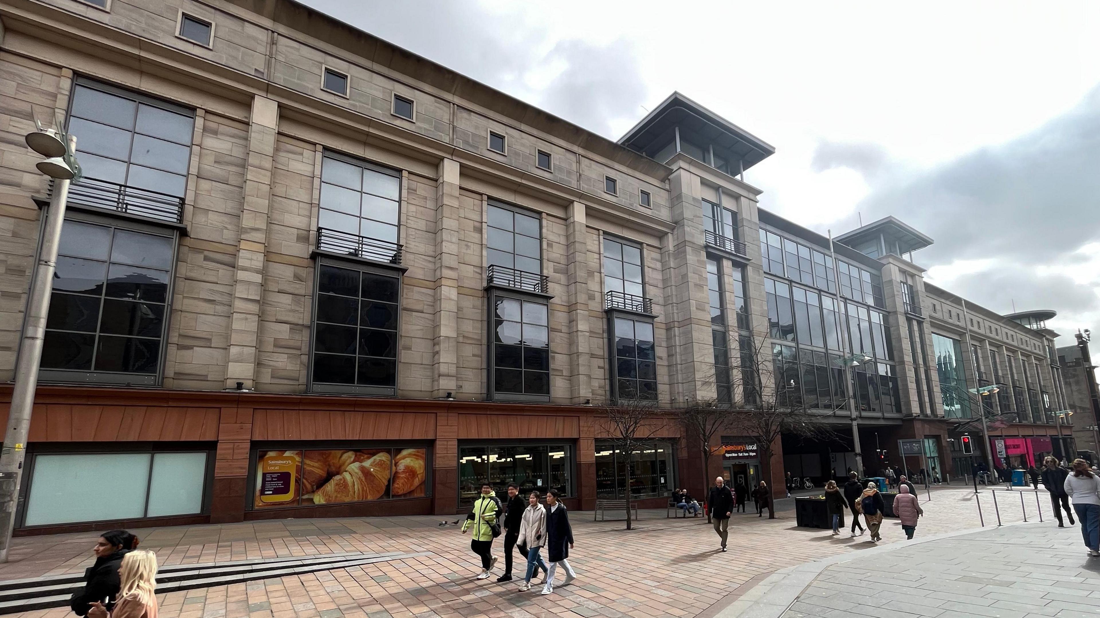 A street view of the Buchanan Galleries with shoppers walking by