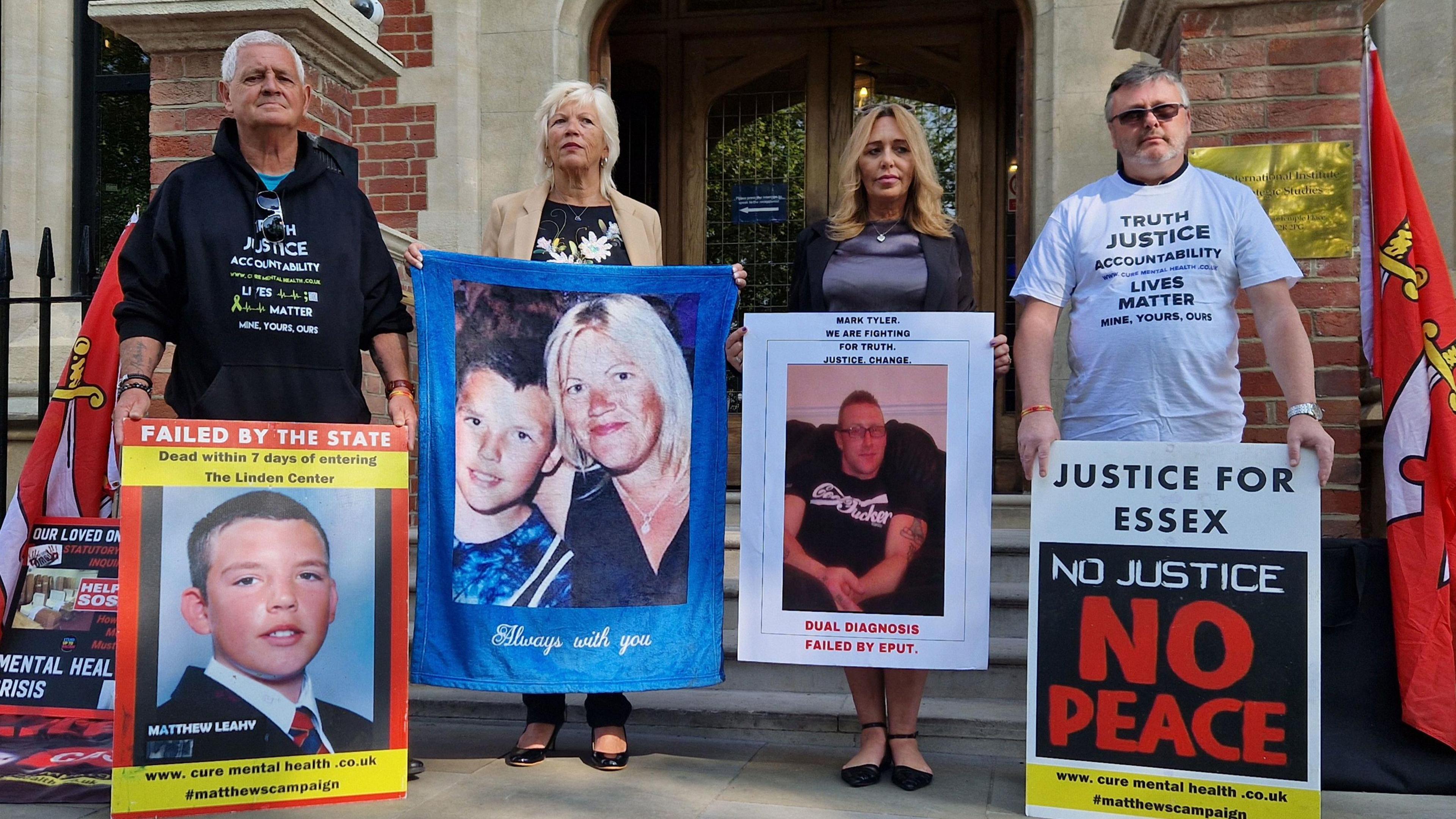 left to right - Will Crowley, Melanie Leahy, Sally Mizen and John Marsh outside Arundel House in London, where the Lampard Inquiry is taking place. The bereaved family members are holding up posters of their loved ones with slogans like 'No justice, no peace'