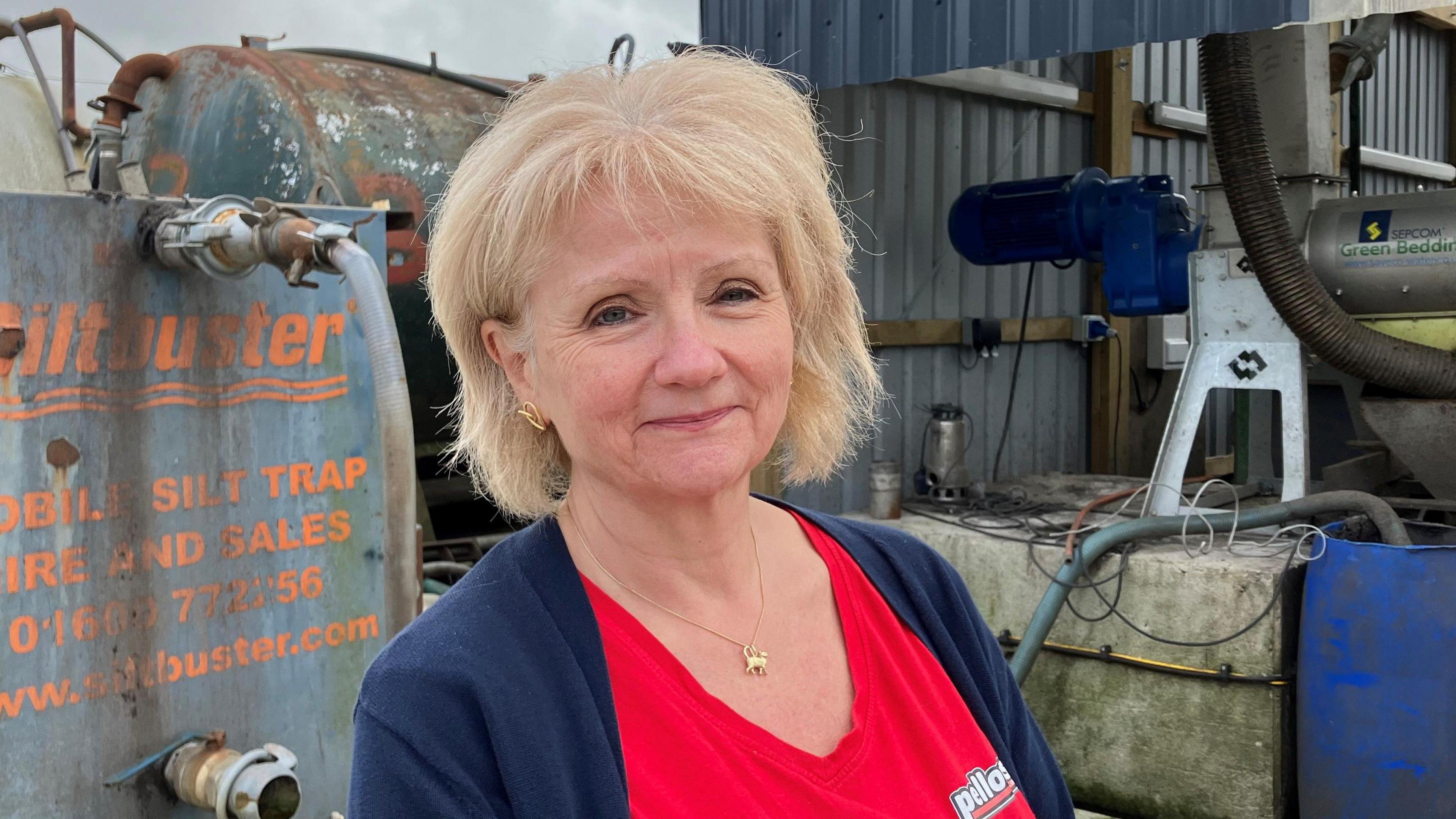 Linda Martin standing in the processing yard