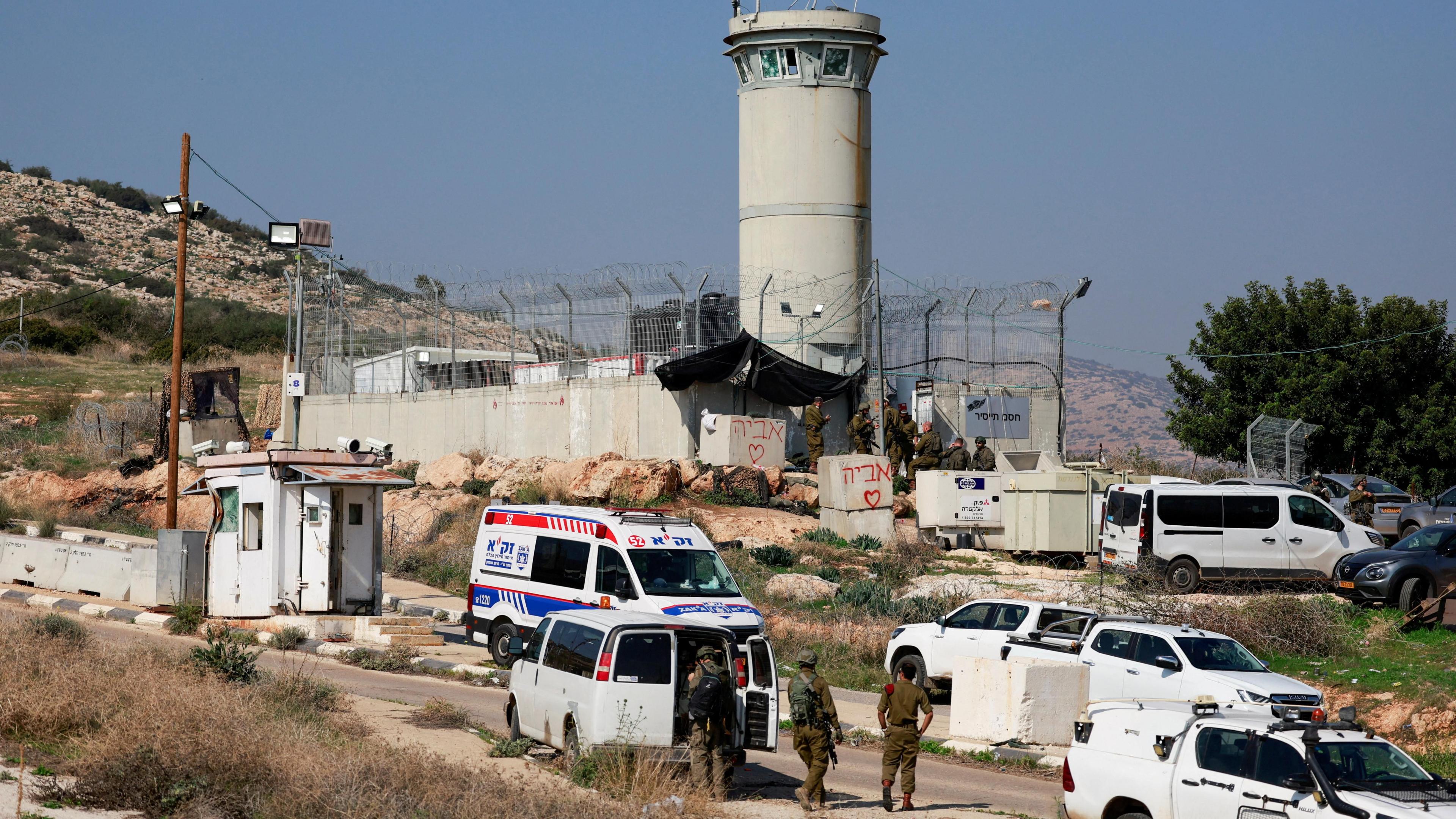 Israeli soldiers and emergency personnel at the scene of a shooting attack on a military post next to the Tayasir checkpoint, in the occupied West Bank, in which two soldiers were killed (4 February 2025)