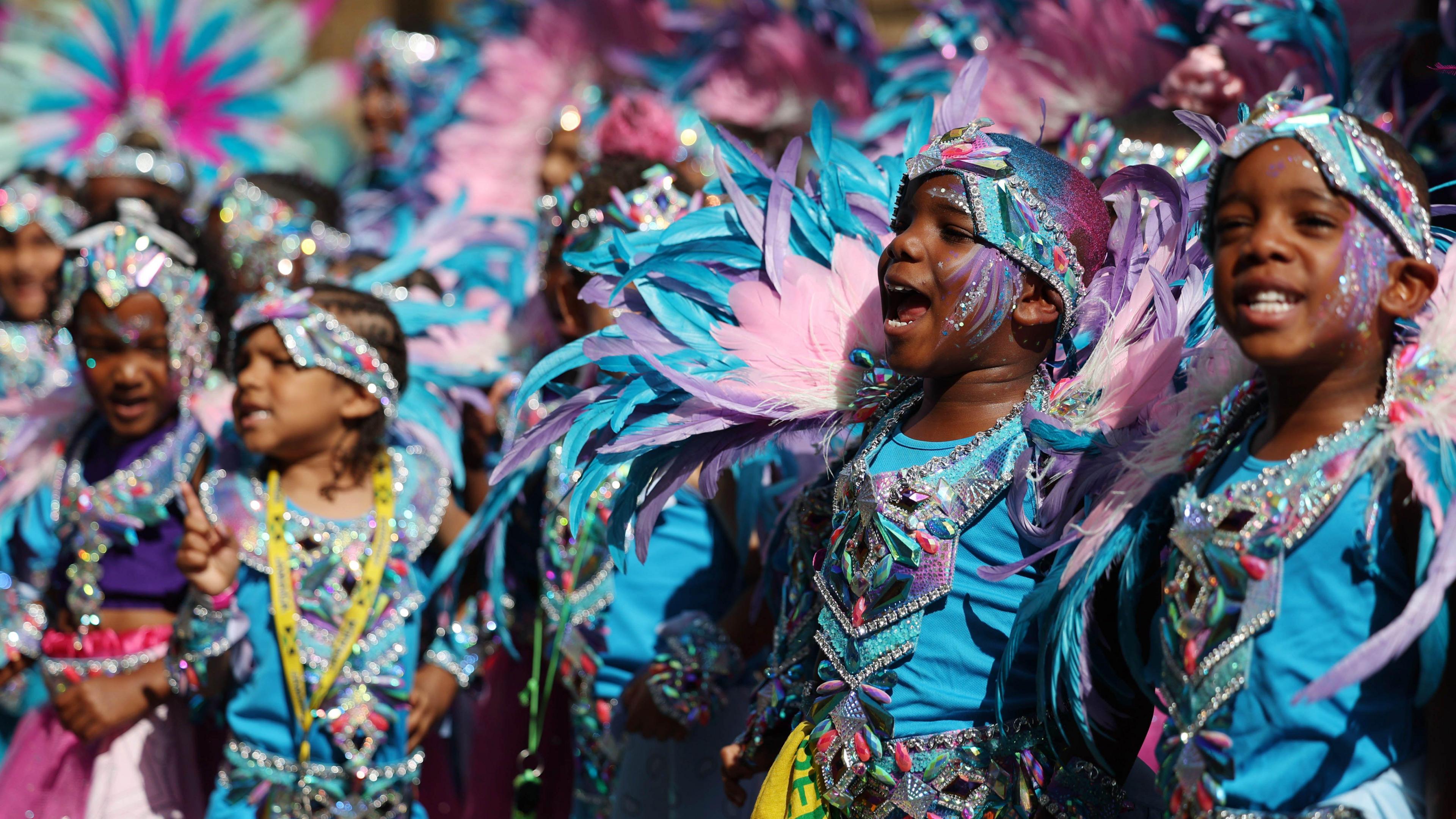 Boys and girls in glittery jewelled festival outfits
