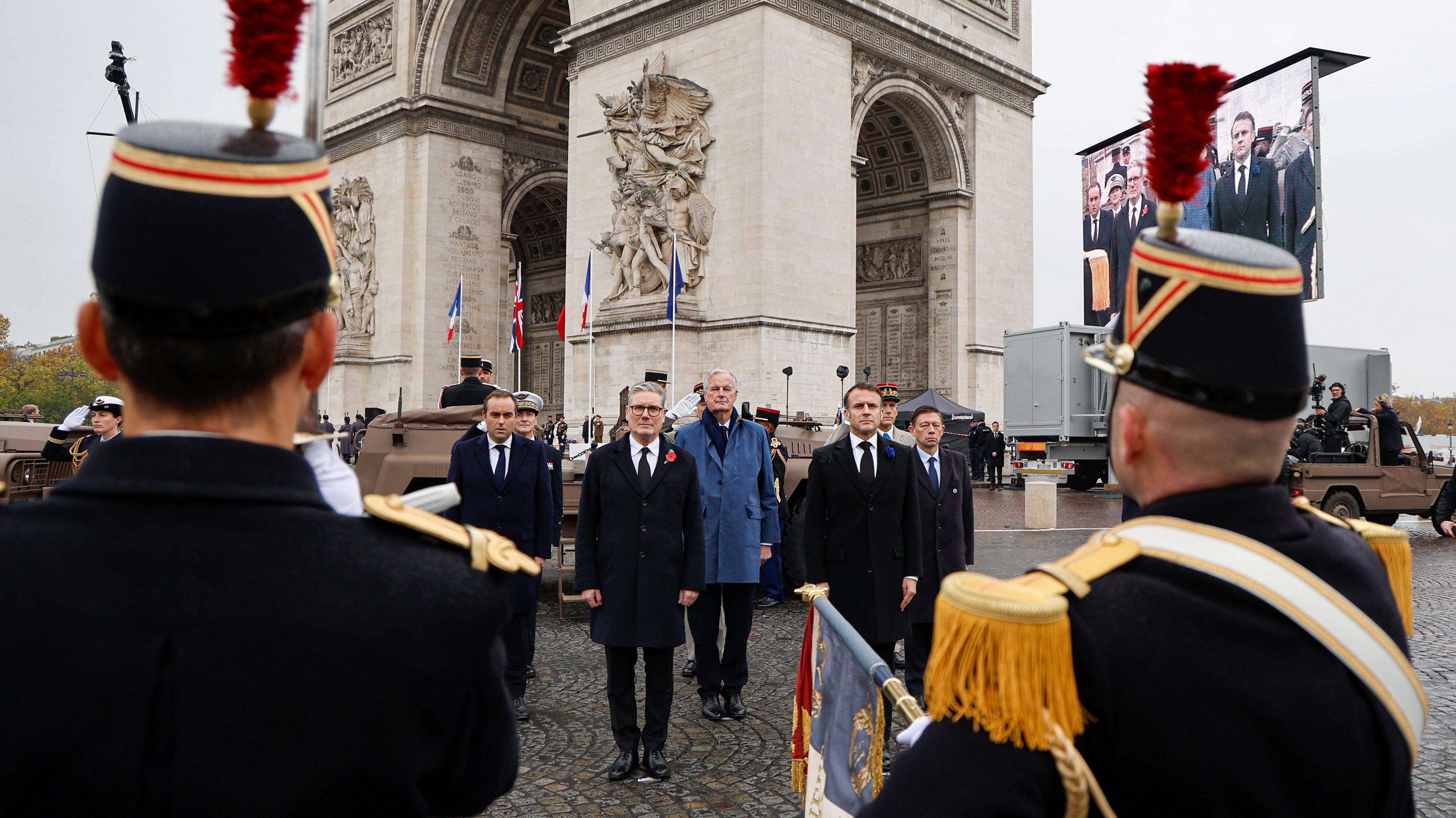 (L-R) France's Minister for the Armed Forces Sebastien Lecornu, Britain's Prime Minister Keir Starmer, France's Prime Minister Michel Barnier and France's President Emmanuel Macron stand at attnetion as they review troops during the commemorations marking the 106th anniversary of the WWI Armistice, in Paris, France, 11 November 2024.