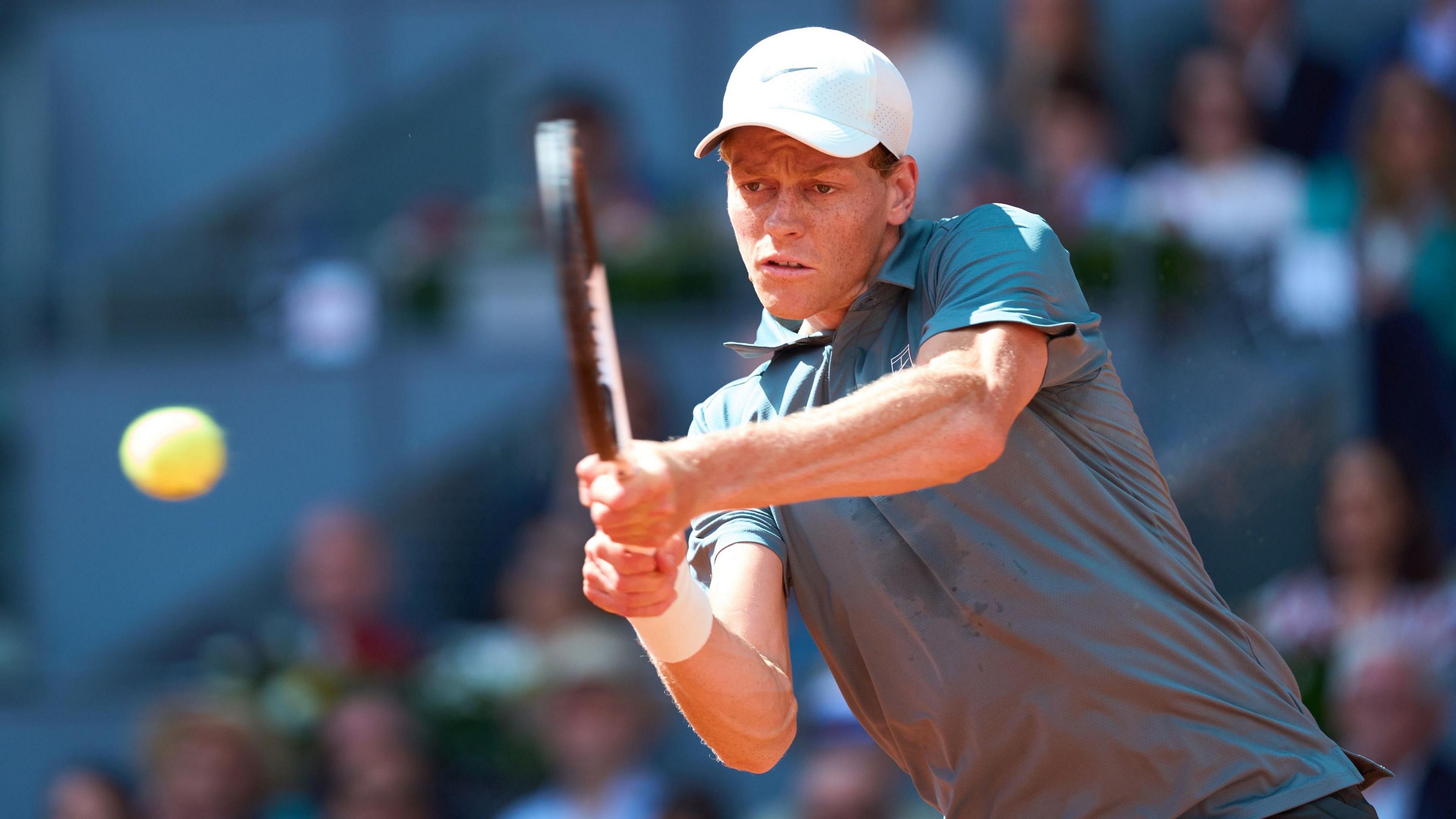 Jannik Sinner in action against Arthur Fils at the Madrid Open