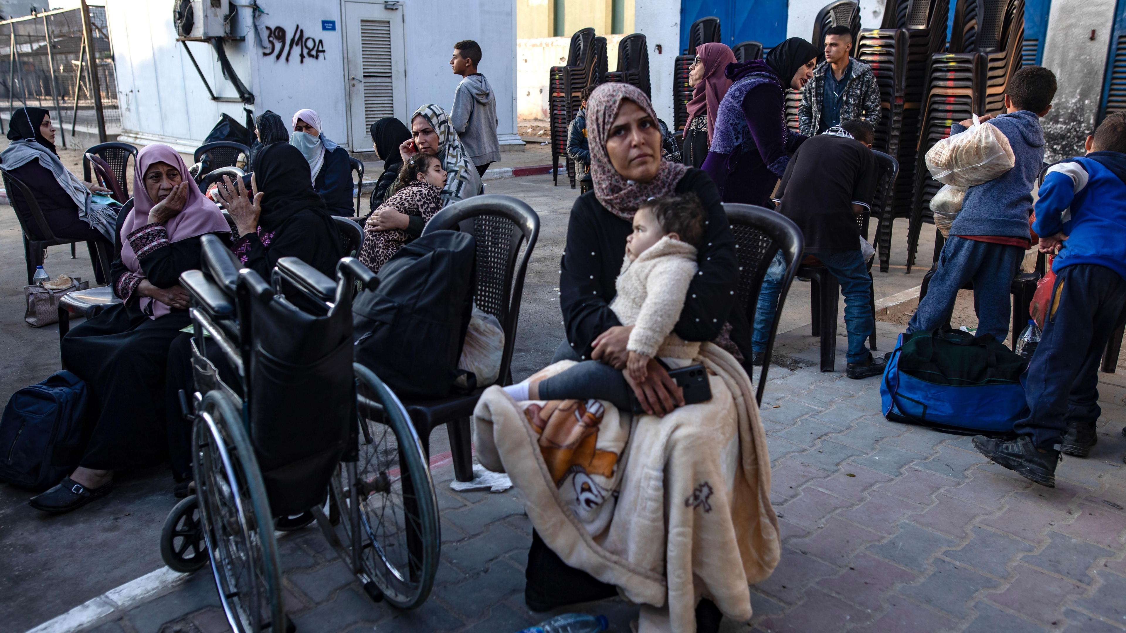 Palestinian patients wait before an evacuation organized by the World Health Organization (WHO) at the European Hospital in Khan Younis, in the southern Gaza Strip, (6 November 2024)