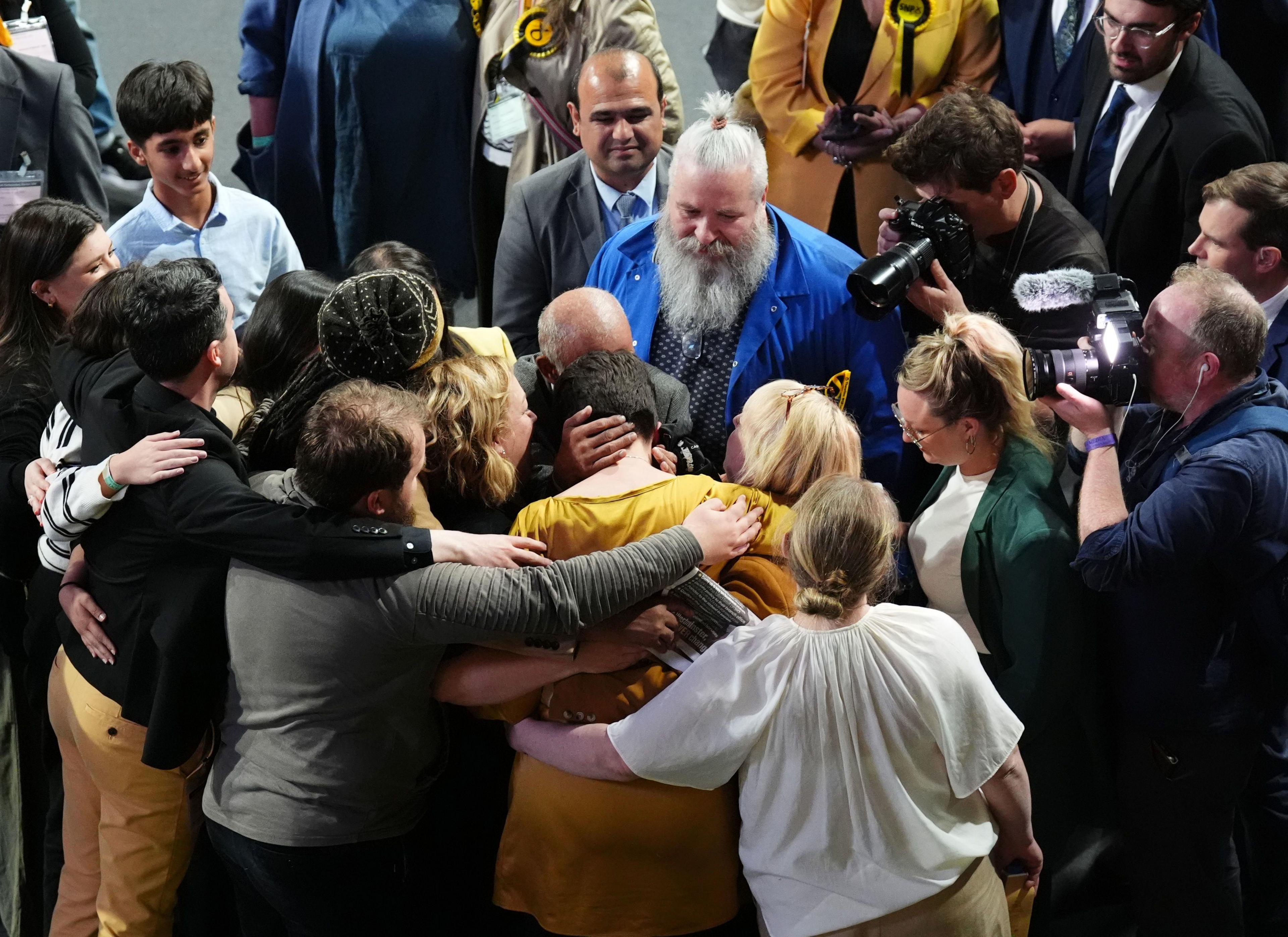 SNP supporters console an unsuccessful candidate