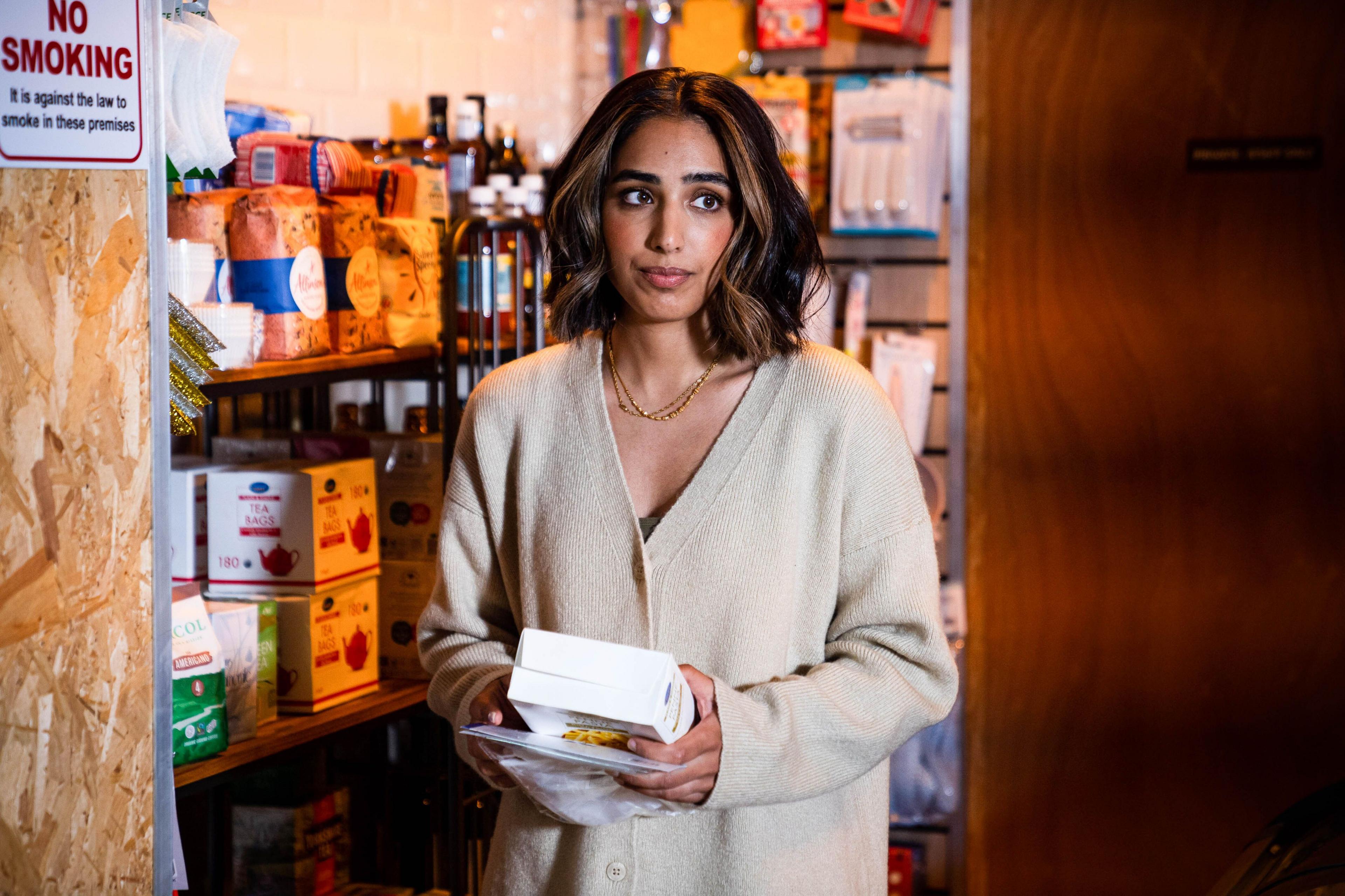 Ash Panesar from eastenders in a corner shop