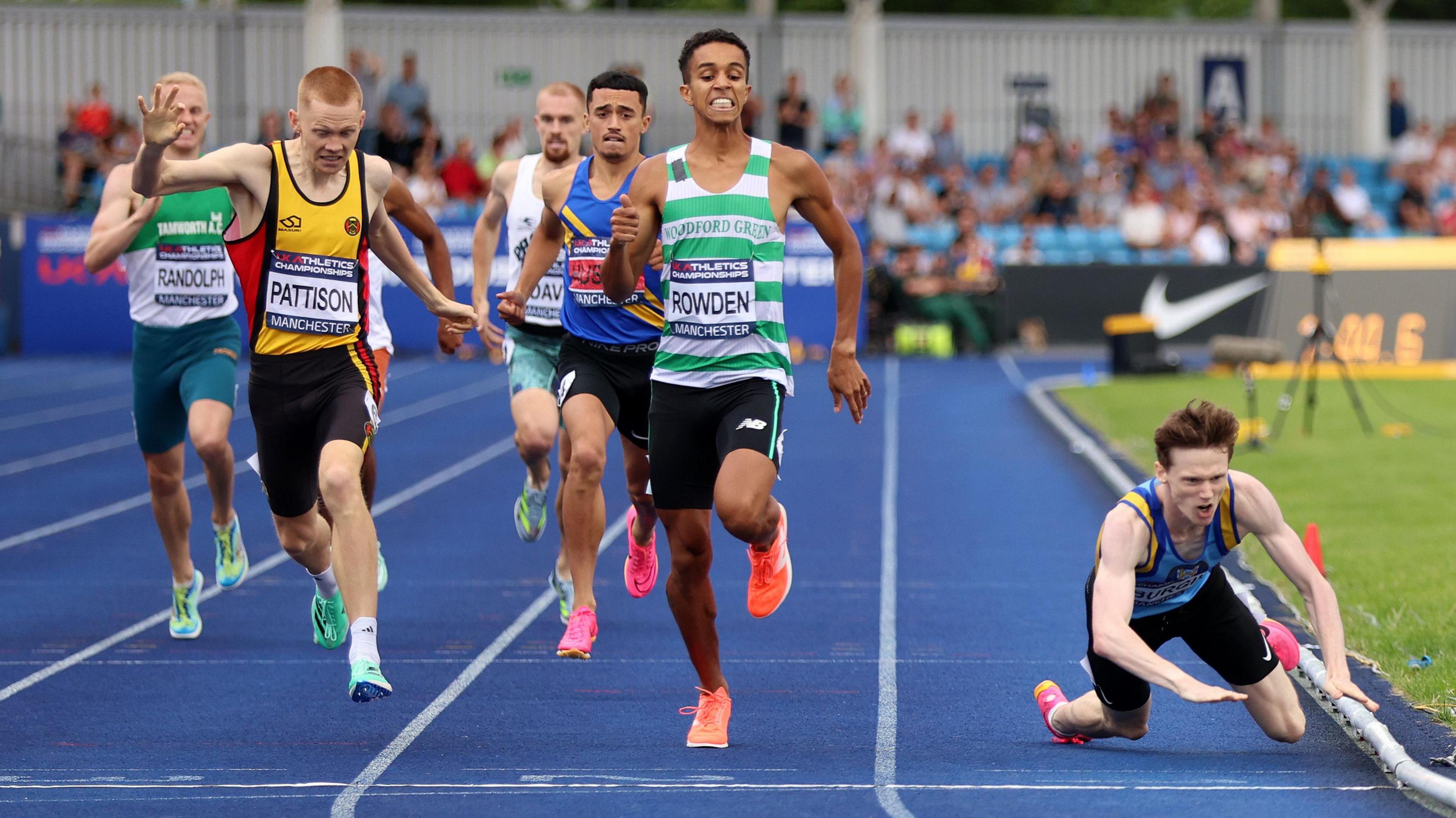 Max Burgin falls over the finish line at the 2023 UK Athletics Championships